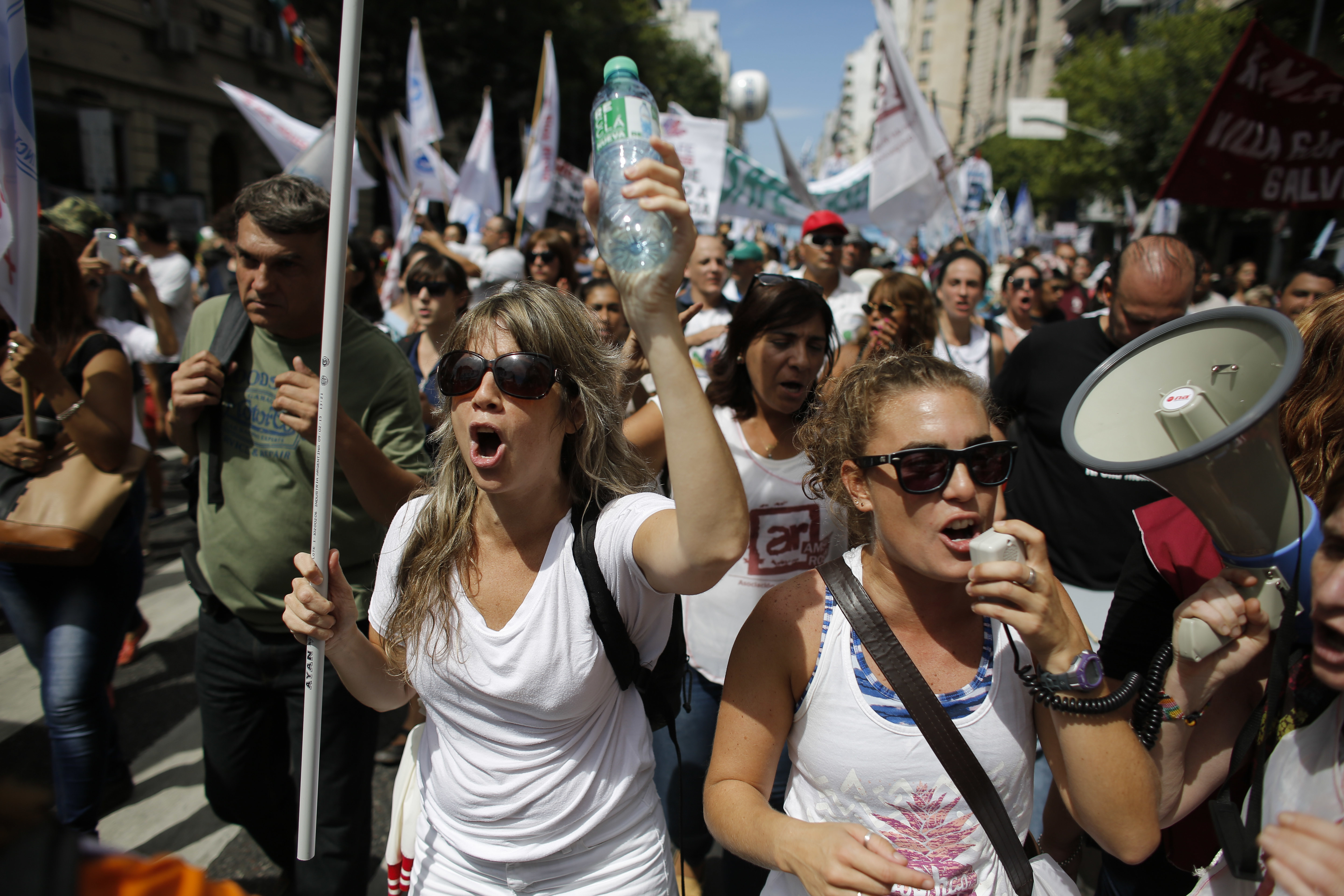 Teachers shout slogans during a protest in Buenos Aires, Argentina, Monday, March 6, 2017. Teachers in a nationwide strike have left millions of children without classes in the first serious union conflict for president's Mauricio Macri's administration. (AP Photo/Victor R. Caivano)