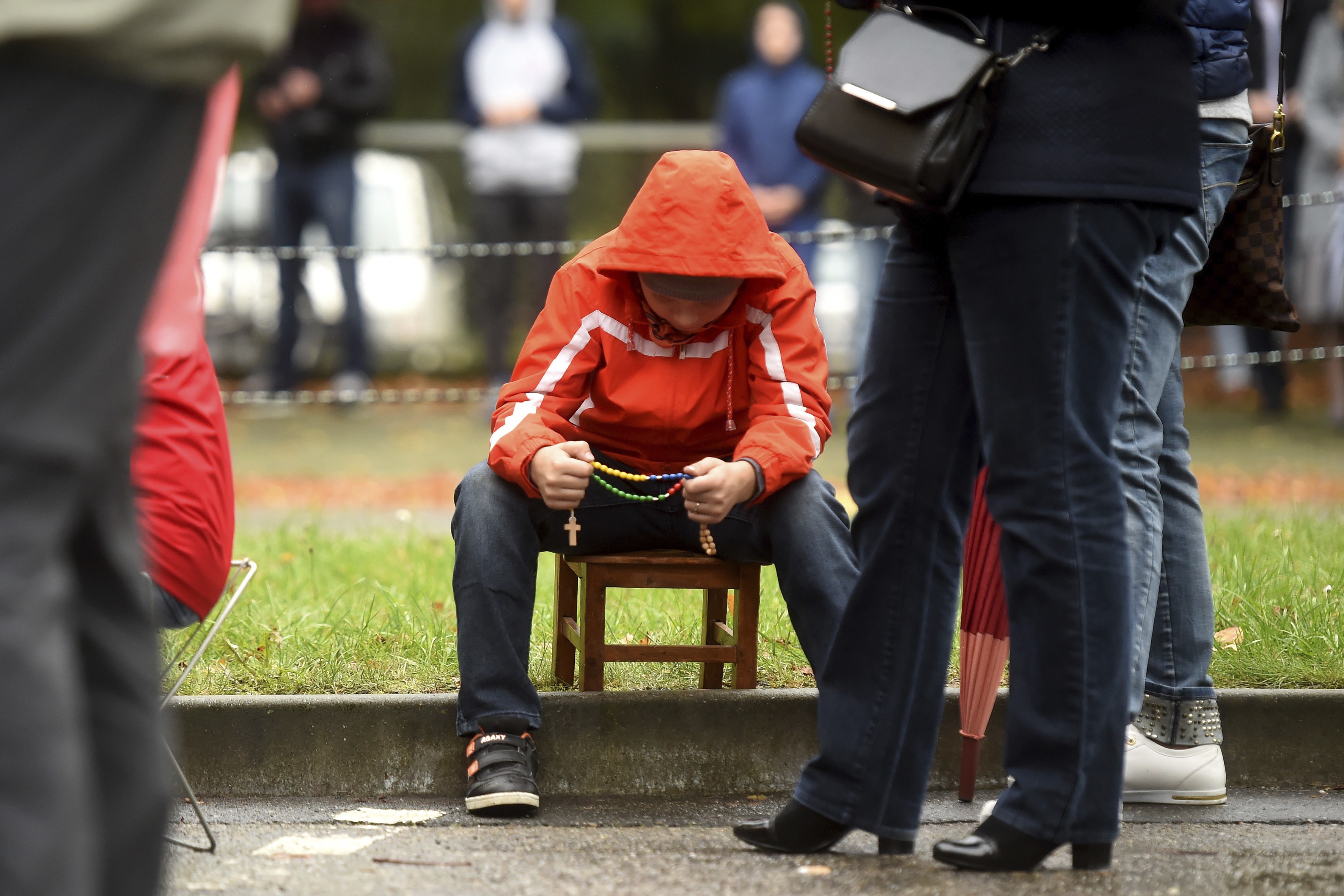 Hundreds of Polish pilgrims prayed during the unusual event Rosary on the Borders near the Polish-Czech border at the former border crossing in Chalupki, Poland, October 7, 2017. Polish Catholics held rosaries and prayed together along the country's 3,500-kilometer border, appealing to the Virgin Mary and God for salvation for Poland and the world. Rosary on the Borders event was organized by lay Catholics but was also endorsed by Polish church authorities, with 320 churches from 22 dioceses taking part. The prayers took place from the Baltic Sea coast in the north to the mountains along Poland's southern borders with the Czech Republic and Slovakia, and all along the border of this country of 38 million where more than 90 percent declare themselves Roman Catholics. Photo/Jaroslav Ozana (CTK via AP Images)