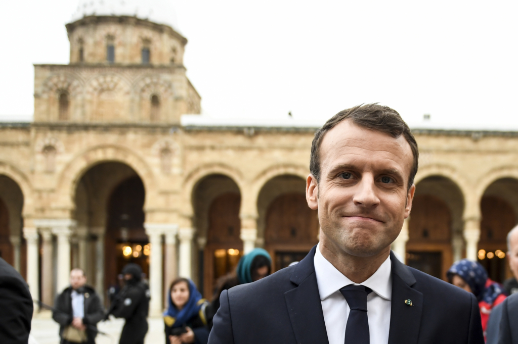 French President Emmanuel Macron and his wife Brigitte walk in the Medina - Tunis