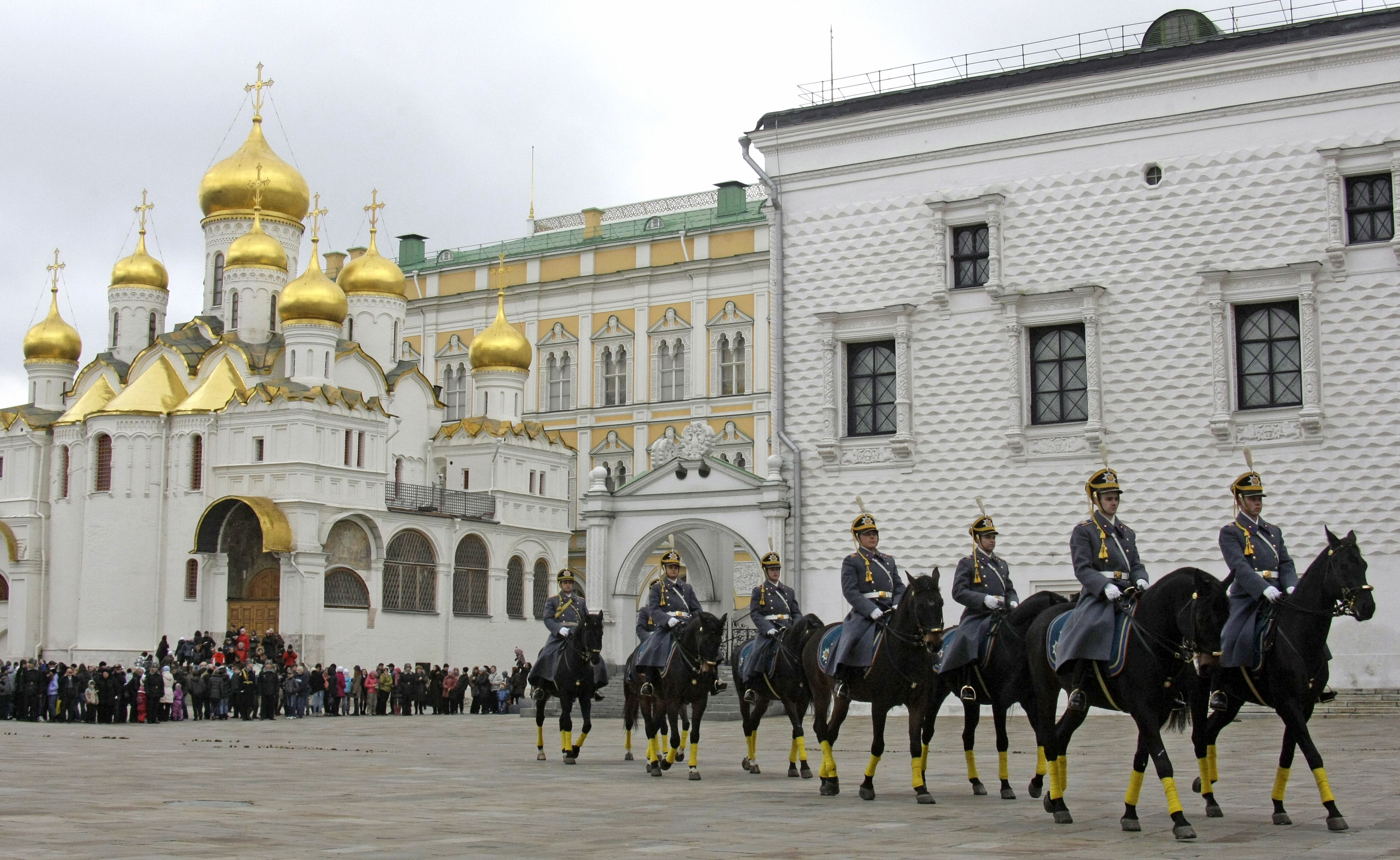 Kremlin cavalry guards parade in Cathedral Square during a ceremony of the Changing of the Guard in front of the Annunciation Cathedral in the Kremlin in Moscow, Russia, Saturday, Oct. 30, 2010. Saturday's czarist-style ceremony, the last of the season, was inaugurated by the Kremlin last April to pull in tourists. The Kremlin guards were wearing uniforms designed to resemble Russian military uniforms used at the time of Czar Nicholas II in 1907-1913. (AP Photo/Mikhail Metzel)