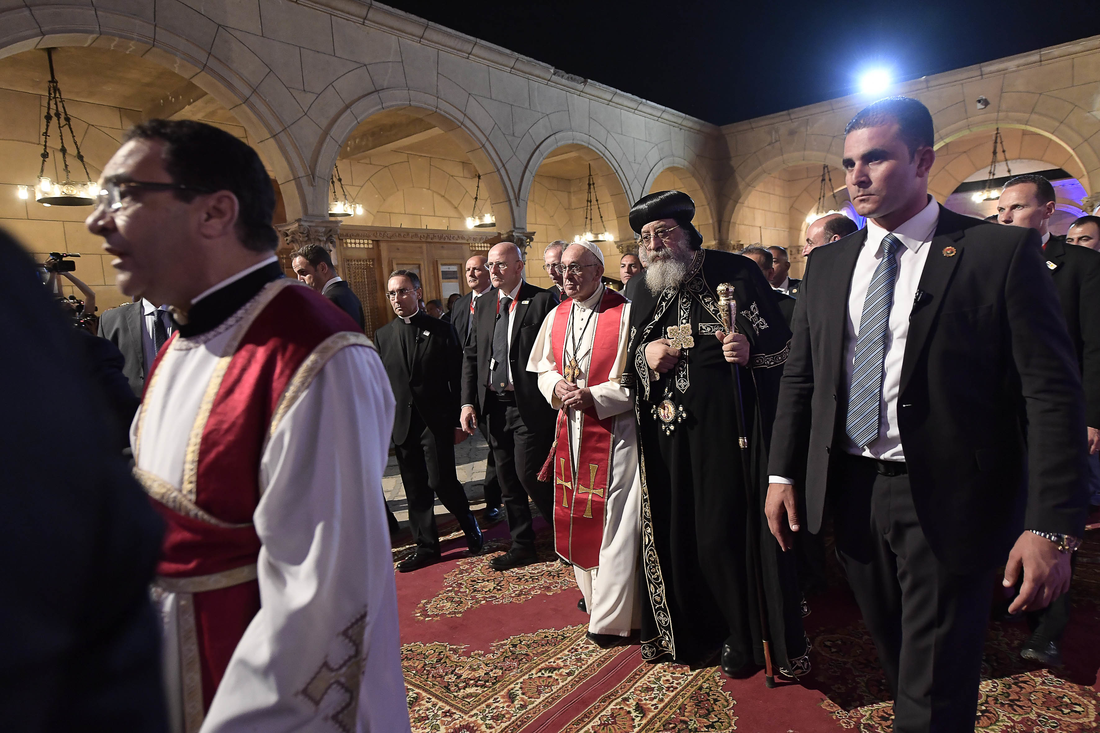 Pope Francis walks beside Pope Tawadros II, spiritual leader of Egypt's Orthodox Christians, at Cairo's St. Mark's Cathedral, Friday, April 28, 2017. Francis is in Egypt for a two-day trip aimed at presenting a united Christian-Muslim front that repudiates violence committed in God's name (L'Osservatore Romano/Pool Photo via AP)