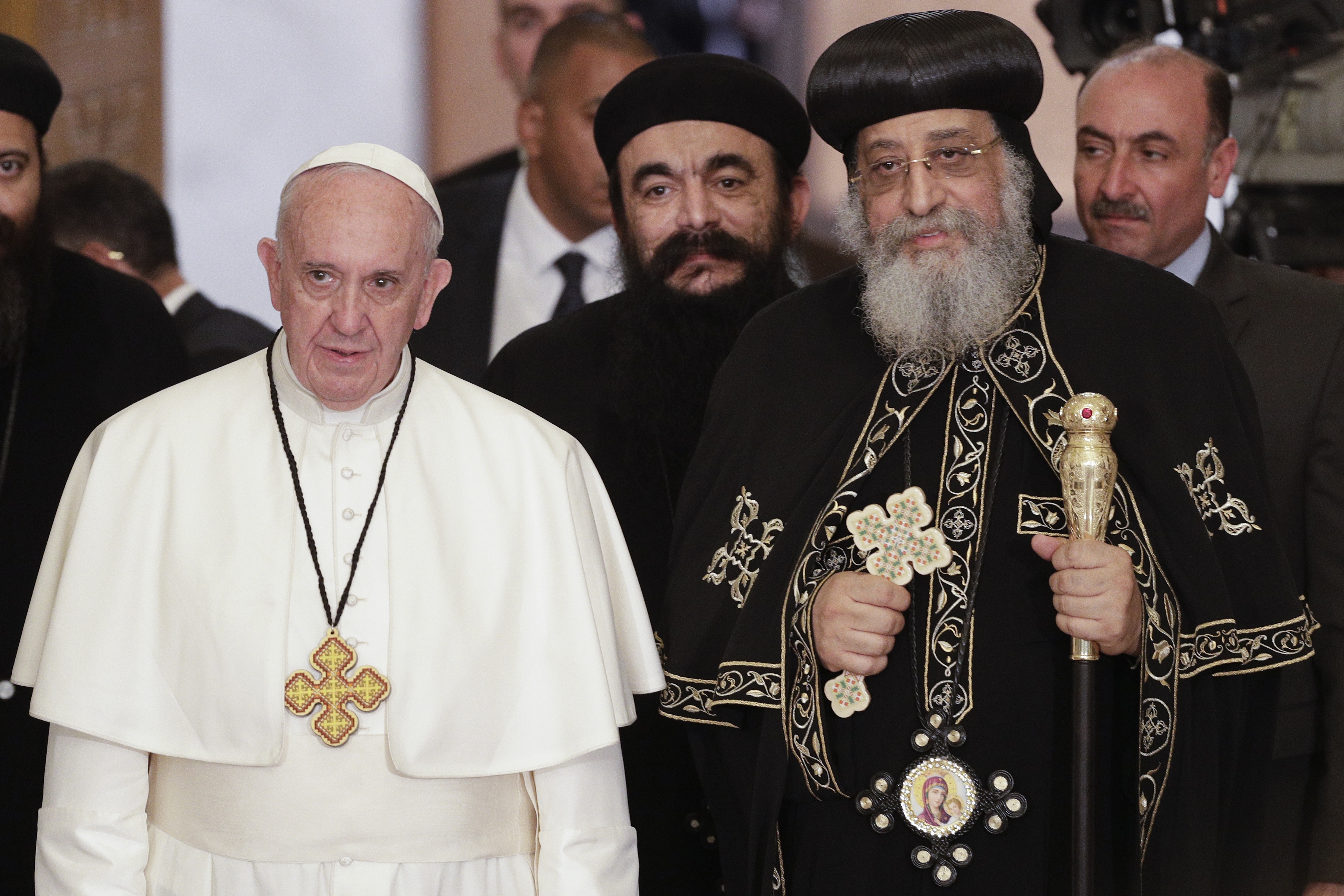 Pope Francis, left, is flanked by Pope Tawadros II, spiritual leader of Egypt's Orthodox Christians, 2nd from right, at Cairo's St. Mark's Cathedral, Friday, April 28, 2017. Francis is in Egypt for a two-day trip aimed at presenting a united Christian-Muslim front that repudiates violence committed in God's name. (AP Photo/Gregorio Borgia)