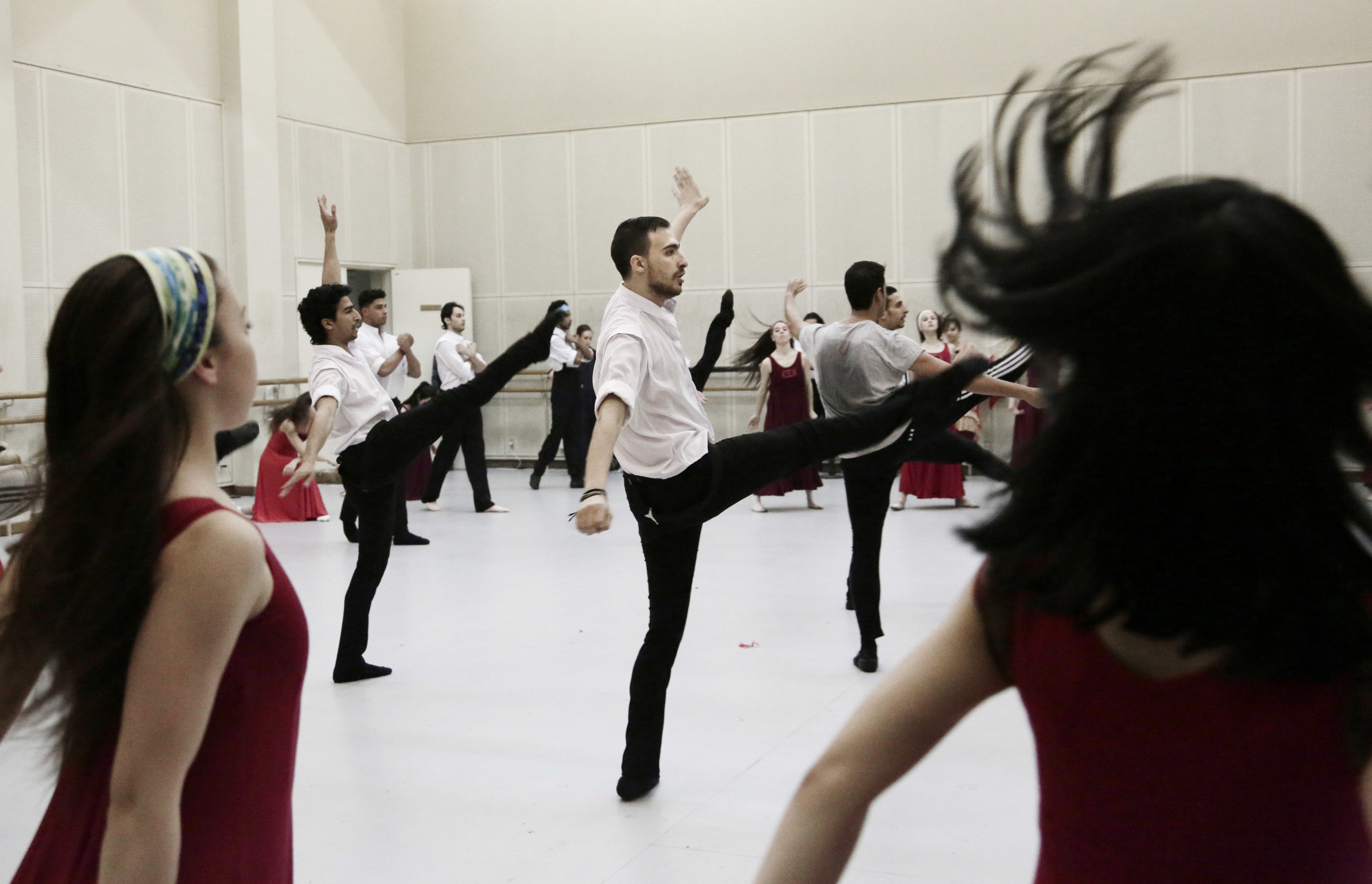 In this March 23, 2017 photo, Fady el-Nabarawy, center, practices during a rehearsal at the Cairo Opera House, Egypt. Egypt’s national ballet company is rebuilding after years of political turmoil and economic pain. Ballet may be an elite Western art, it may be far removed from Egyptian society, which has grown more religiously conservative and xenophobic. But it’s still a powerful passion for the Egyptians who dance it and watch it. (AP Photo/Nariman El-Mofty)