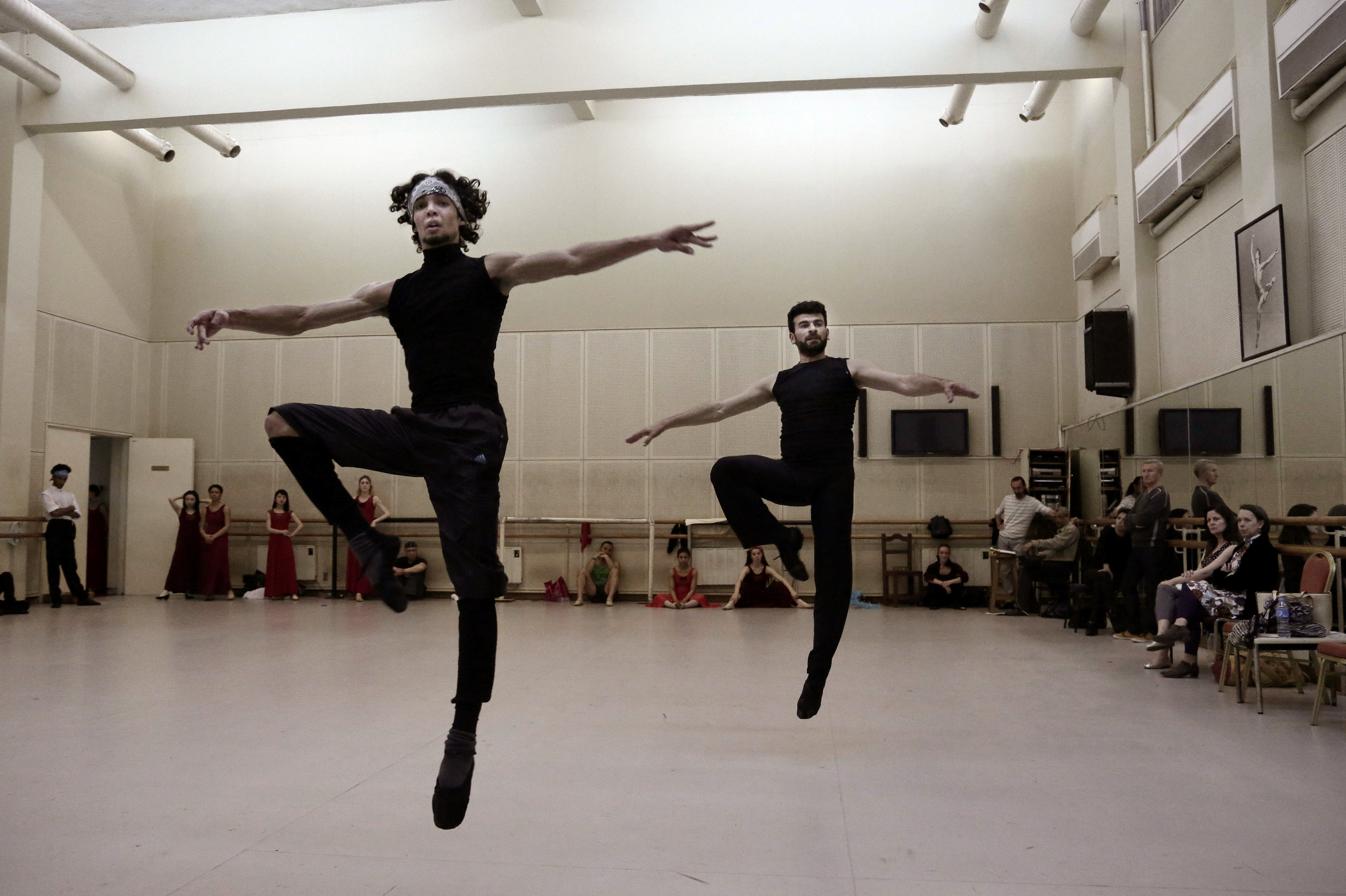 In this March 23, 2017 photo, Ahmed Nabil, left, Hani Hassan, practice during a rehearsal, in the Cairo Opera House, Egypt. The national ballet company is rebuilding after years of political turmoil and economic pain. Ballet may be an elite Western art, it may be far removed from Egyptian society, which has grown more religiously conservative and xenophobic. But it’s still a powerful passion for the Egyptians who dance it and watch it. (AP Photo/Nariman El-Mofty)