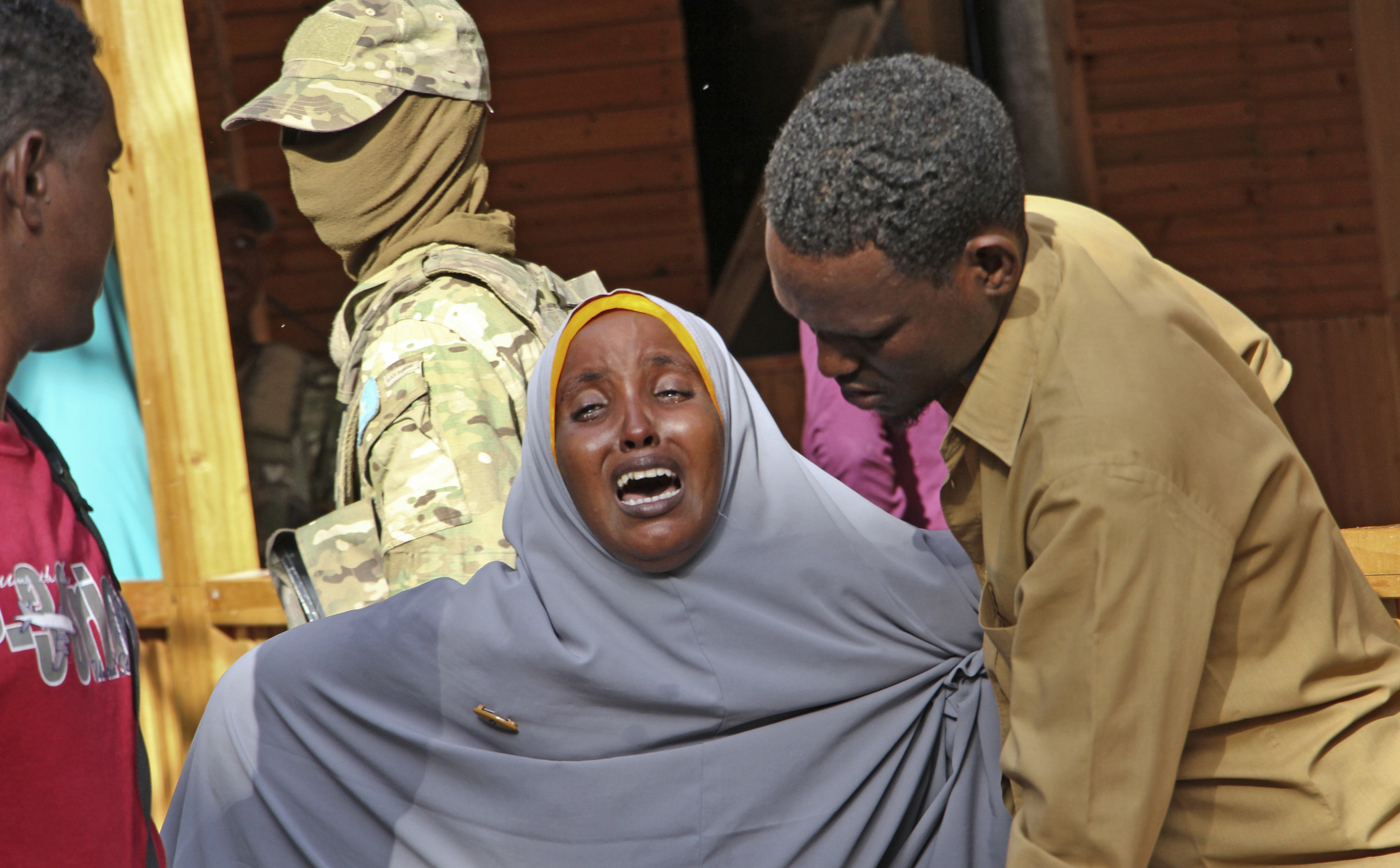 A mother whose daughter was shot in the head by attackers during a militant attack on a restaurant, grieves in Mogadishu, Somalia Thursday, June 15, 2017. Somalia's security forces early Thursday morning ended a night-long siege by al-Shabab Islamic extremists at the popular 