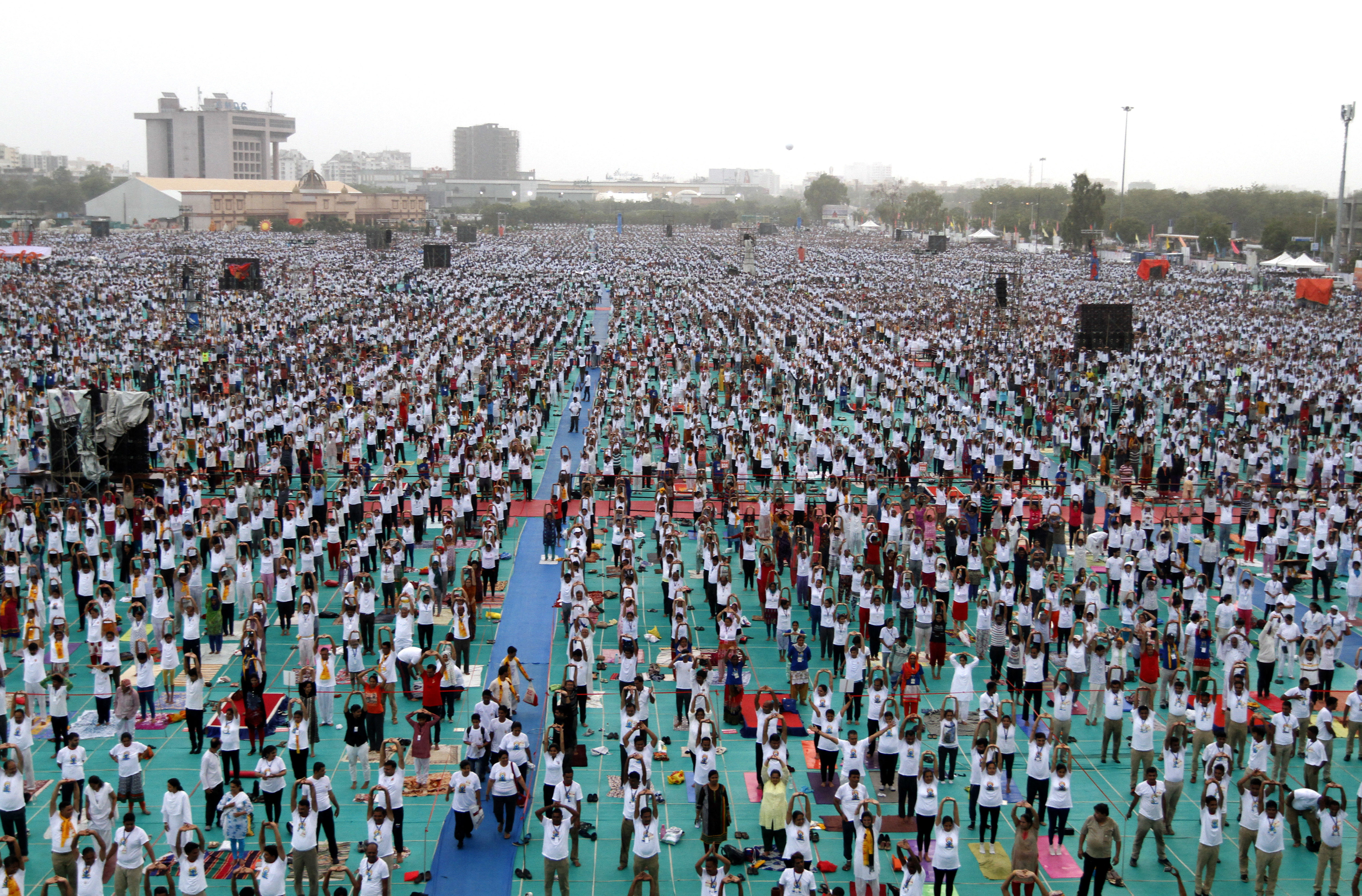 Indians perform Yoga during International Yoga Day celebrations in Ahmadabad, India, Wednesday, June 21, 2017. Millions of yoga enthusiasts across India take part in a mass yoga sessions to mark the third International Yoga Day which falls on June 21 every year. (AP Photo/Ajit Solanki)