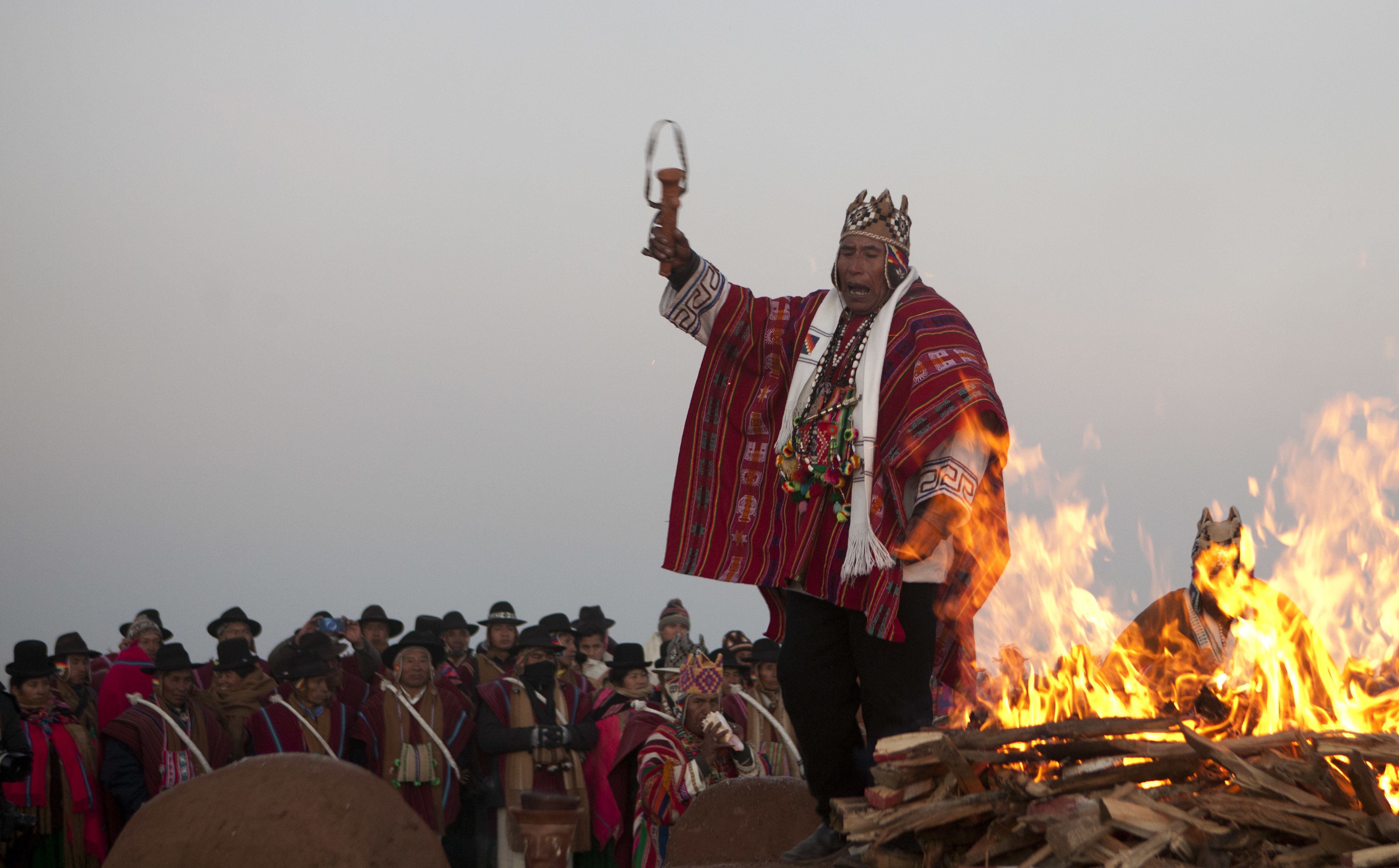 Andean religious leaders perform a New Year's ritual at the ruins of the ancient civilization of Tiwanaku, Bolivia, early Wednesday, June 21, 2017. Bolivia's Aymara Indians are celebrating the year 5,525 as well as the Southern Hemisphere's winter solstice, which marks the start of a new agricultural cycle. (AP Photo/Juan Karita)