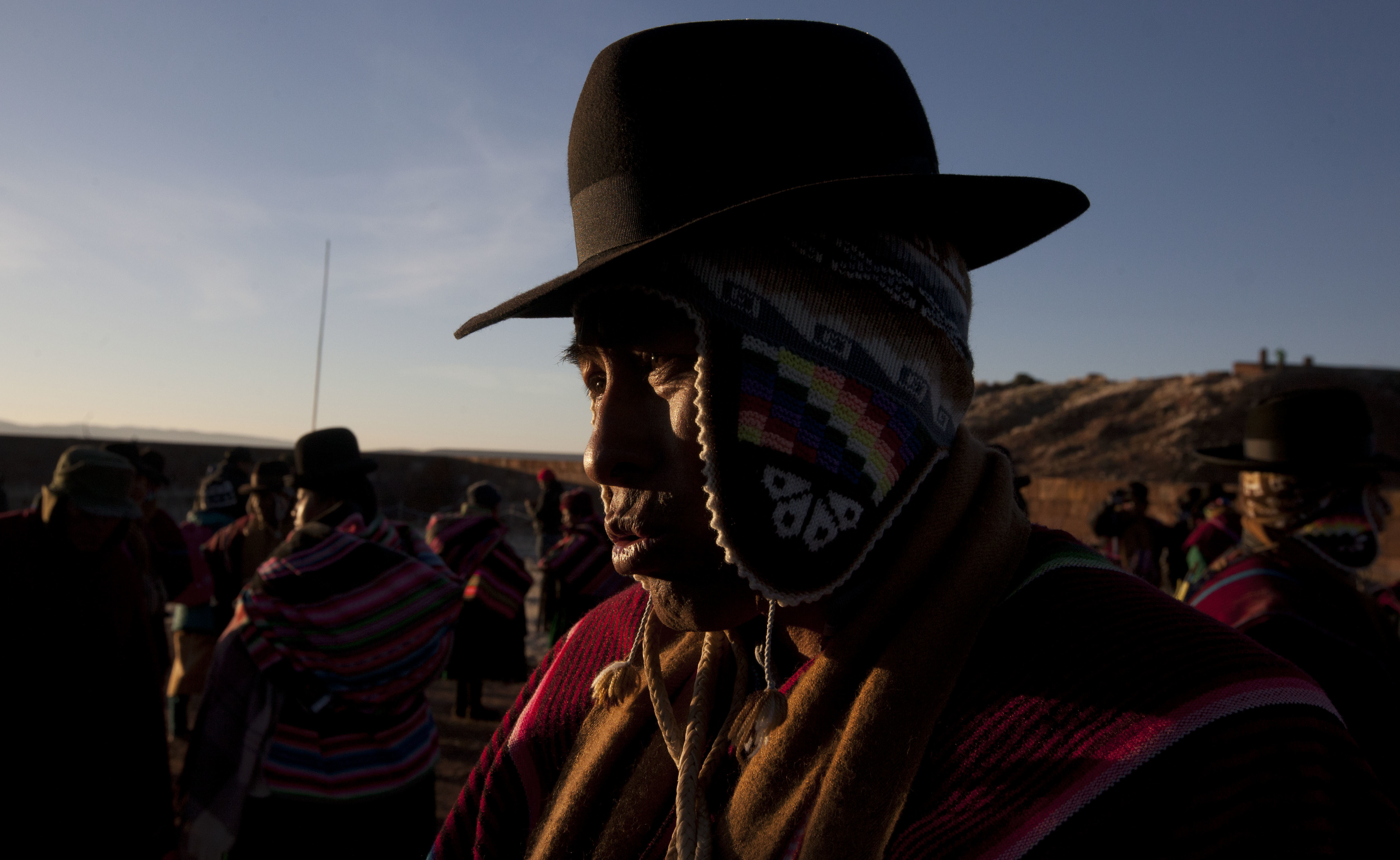 An Aymara Indian participatse at dawn, in the New Year's ritual at the ruins of the ancient city Tiwanaku, Bolivia, early Wednesday, June 21, 2017. Bolivia's Aymara Indians are celebrating the year 5,525 as well as the Southern Hemisphere's winter solstice, which marks the start of a new agricultural cycle. (AP Photo/Juan Karita)
