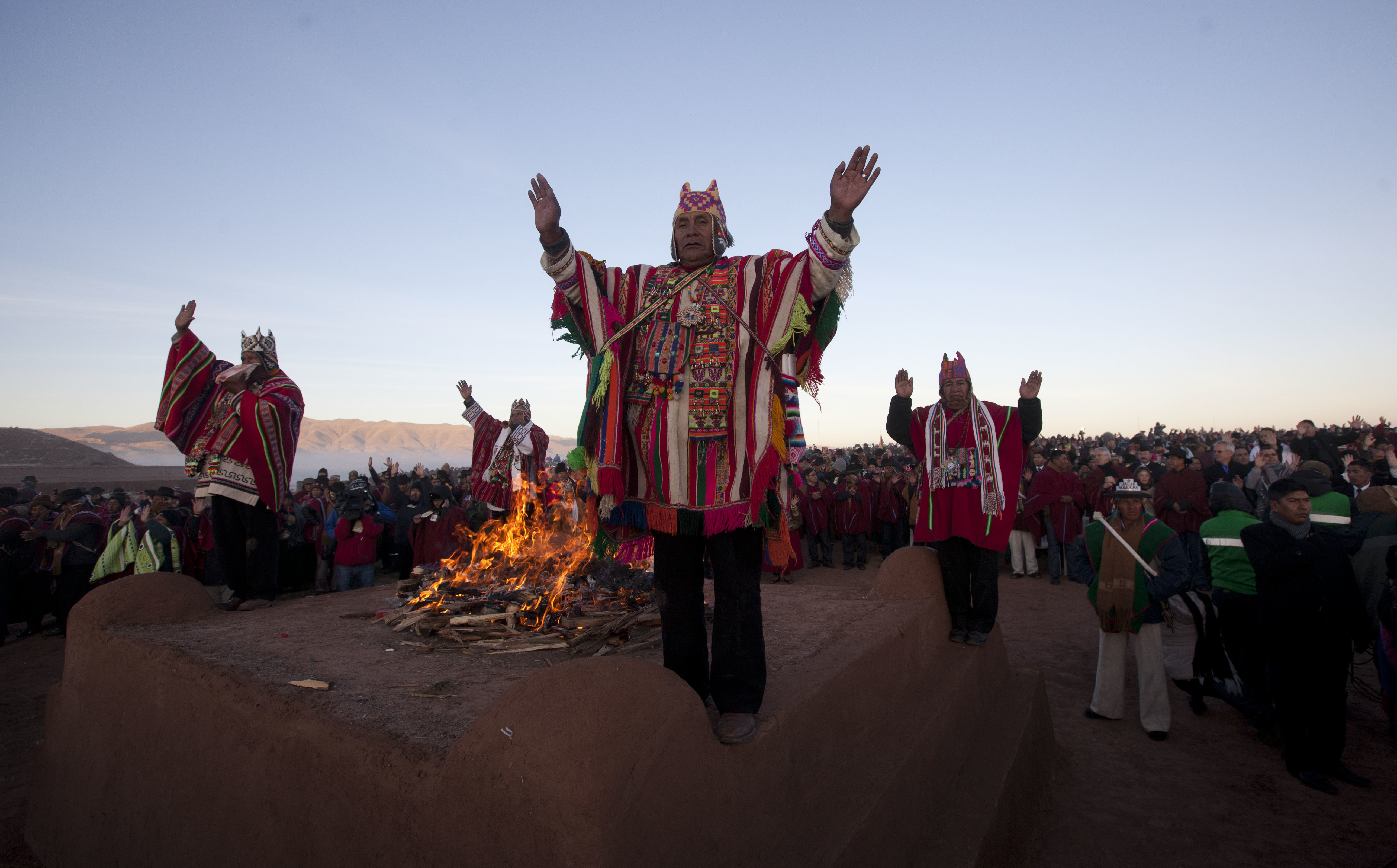 Andean religious leaders perform a New Year's ritual at the ruins of the ancient civilization of Tiwanaku, Bolivia, early Wednesday, June 21, 2017. Bolivia's Aymara Indians are celebrating the year 5,525 as well as the Southern Hemisphere's winter solstice, which marks the start of a new agricultural cycle. (AP Photo/Juan Karita)