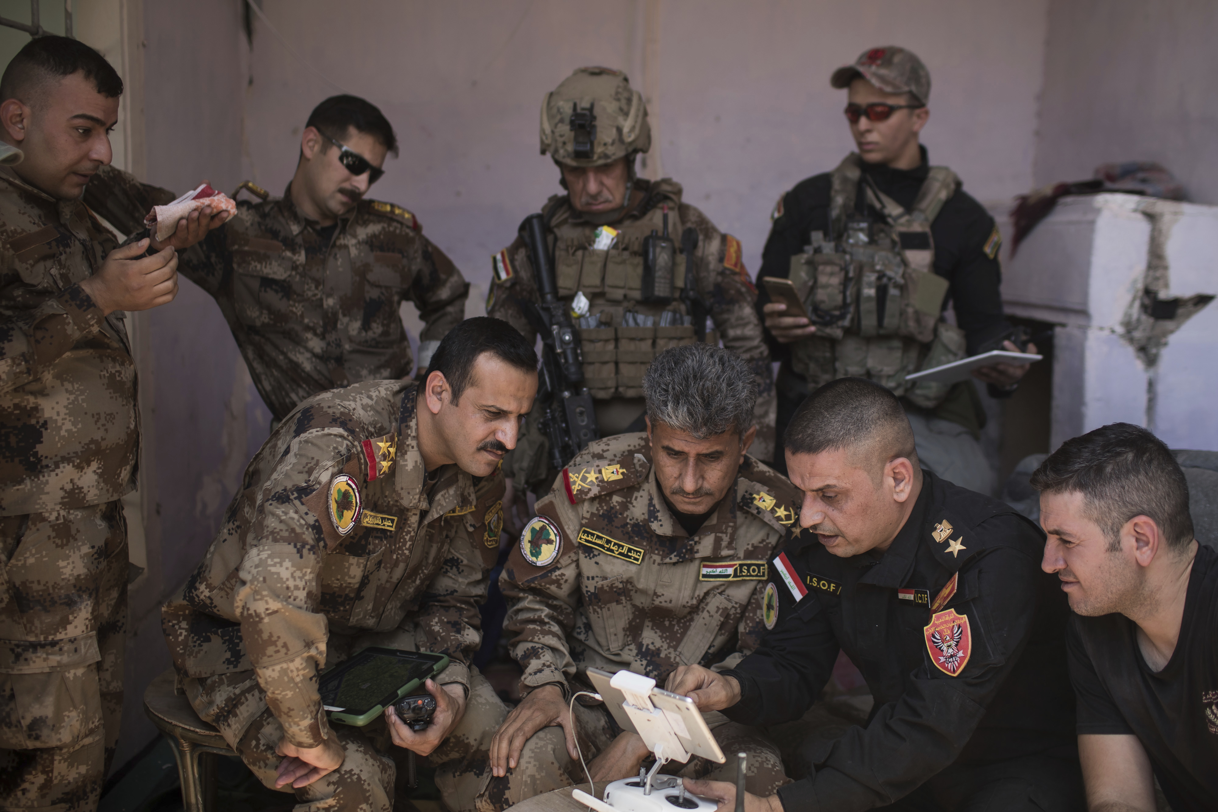 Iraqi special forces Lt. Gen. Abdul-Wahab al-Saadi, center, and his team monitor Islamic State positions in the Old City of Mosul, Iraq, Tuesday, June 27, 2017. An Iraqi officer says counterattacks by Islamic State militants on the western edge of Mosul have stalled Iraqi forces' push in the Old City _ the last IS stronghold in the city. (AP Photo/Felipe Dana)