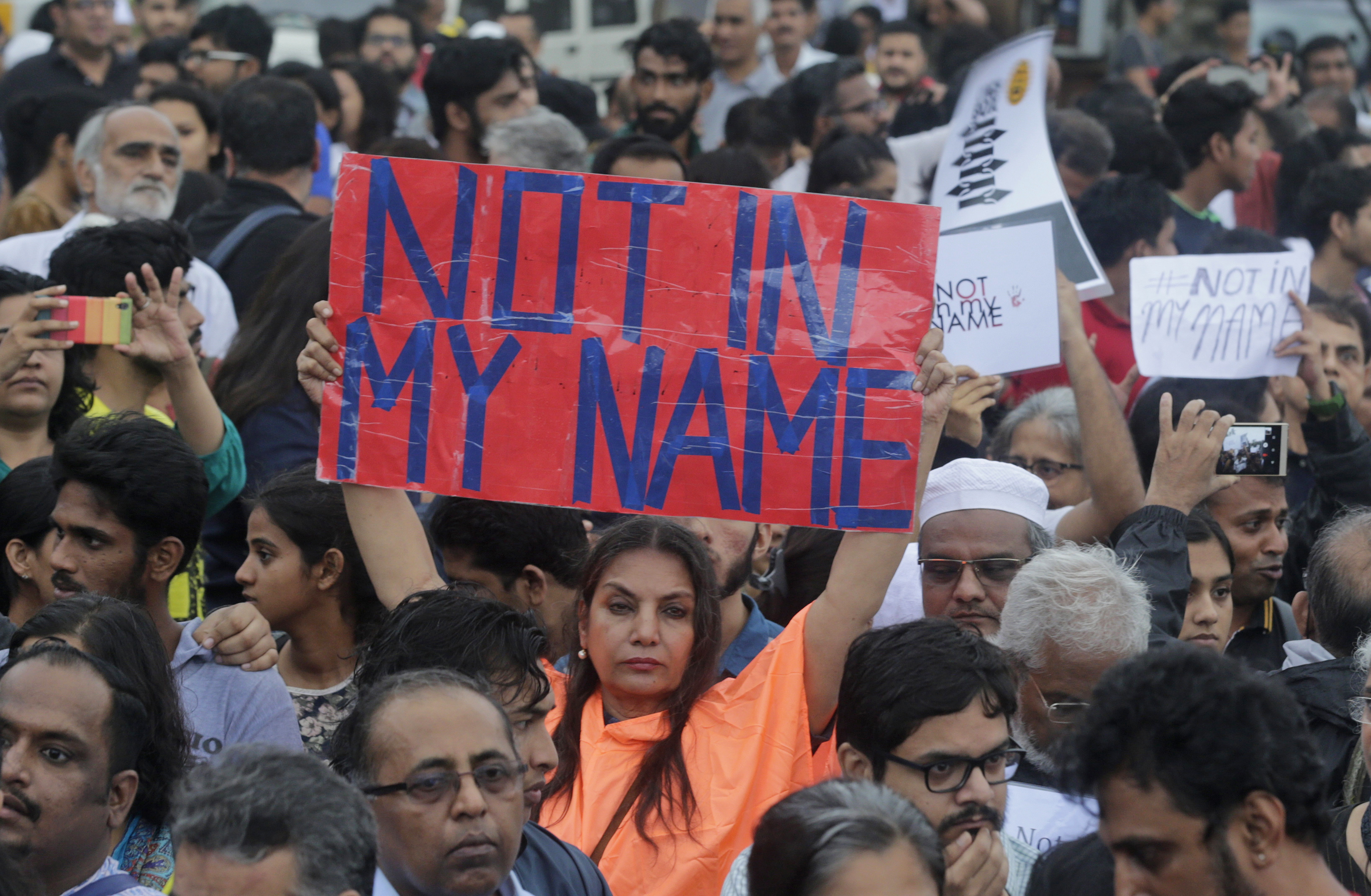 Bollywood actress Shabana Azmi holds a placard high during a protest against a spate of violent attacks across the country targetting the country's Muslim minority, in Mumbai, India, Wednesday, June 28, 2017. Thousands of protestors gathered in different cities to decry the silence of India's Hindu right-wing government in the face of the public lynchings and violent attacks on at least a dozen Muslim men and boys since it was voted to power in 2014. (AP Photo/Rafiq Maqbool)