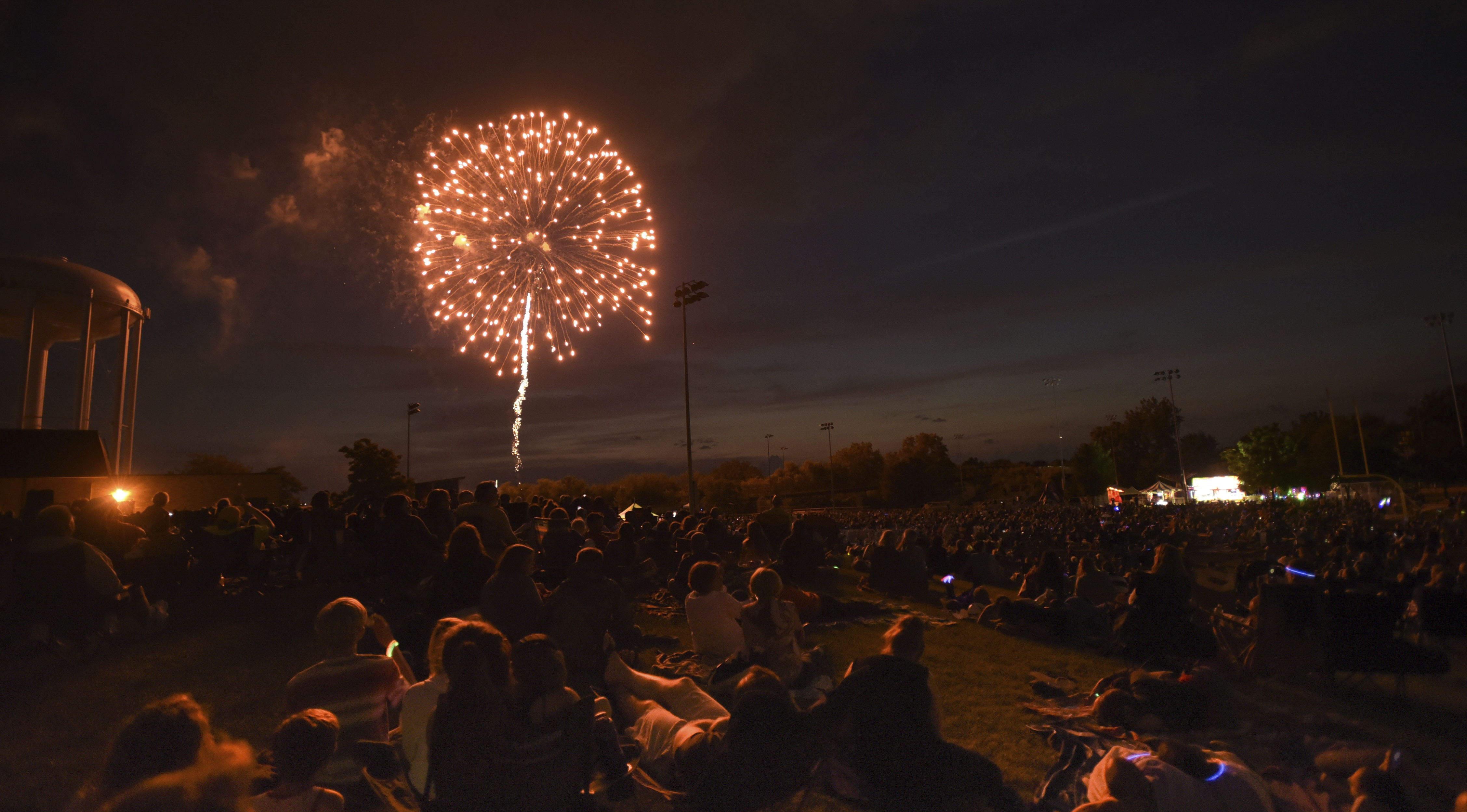 People watch fireworks at Graf Park over Wheaton, Ill., Monday July 3, 2017. (Mark Black/Daily Herald via AP)