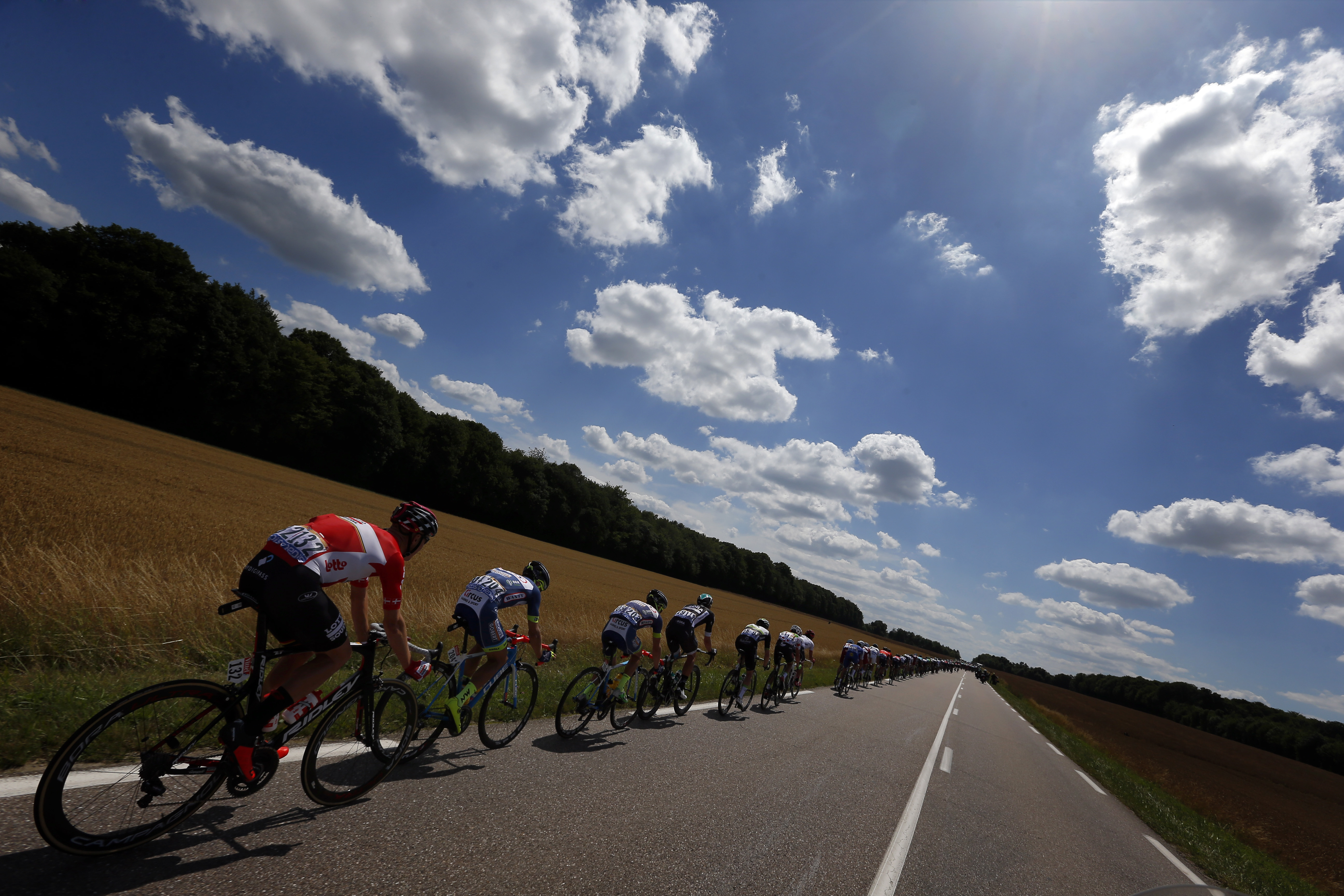 The pack rides during the fourth stage of the Tour de France cycling race over 207.5 kilometers (129 miles) with start in Mondorf-les-Bains, Luxembourg, and finish in Vittel, France, , Tuesday, July 4, 2017. (AP Photo/Peter Dejong)