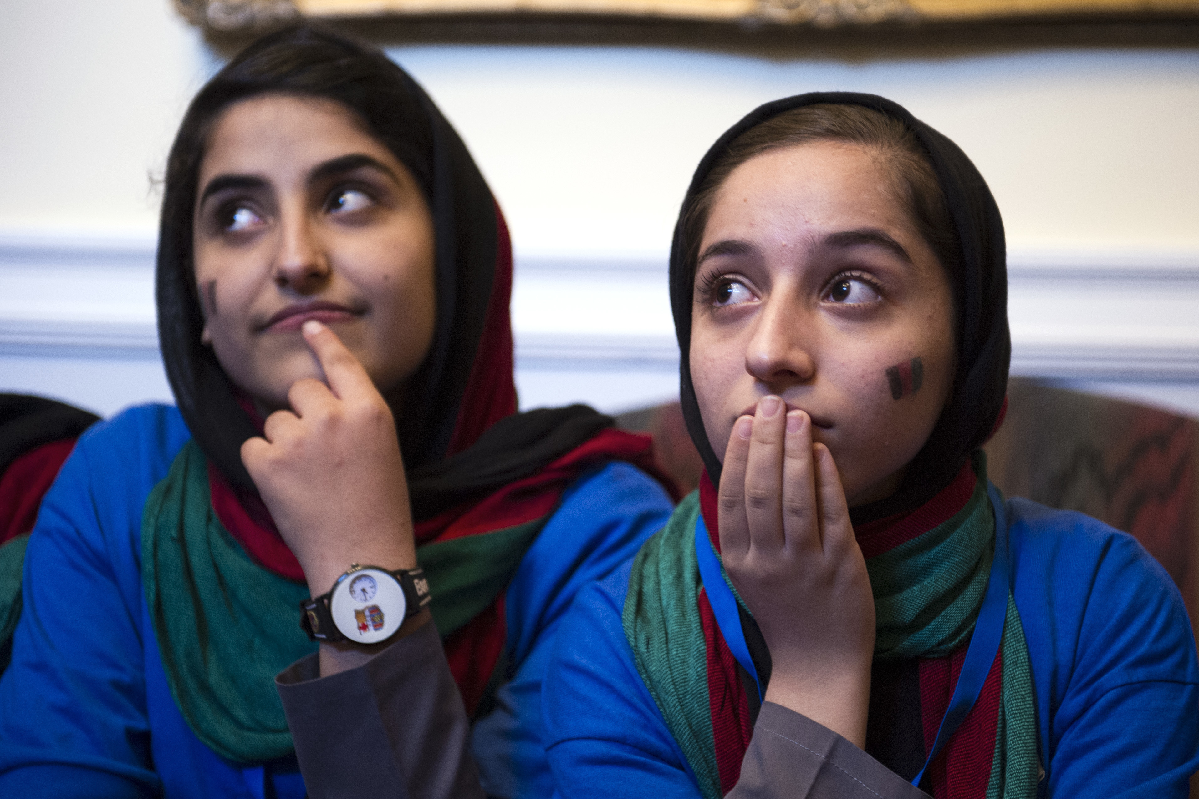Afghanistan's FIRST Global Challenge team member Lida Azizi, left, and Fatemah Qaderyan meet with reporters following the opening ceremony in Washington, Sunday, July 16, 2017. Twice rejected for U.S. visas, the all-girls robotics team arrived in Washington on Saturday and will compete against entrants from more than 150 countries in the three-day high school competition. It's the first annual robotics competition designed to encourage youths to pursue careers in math and science. (AP Photo/Cliff Owen)