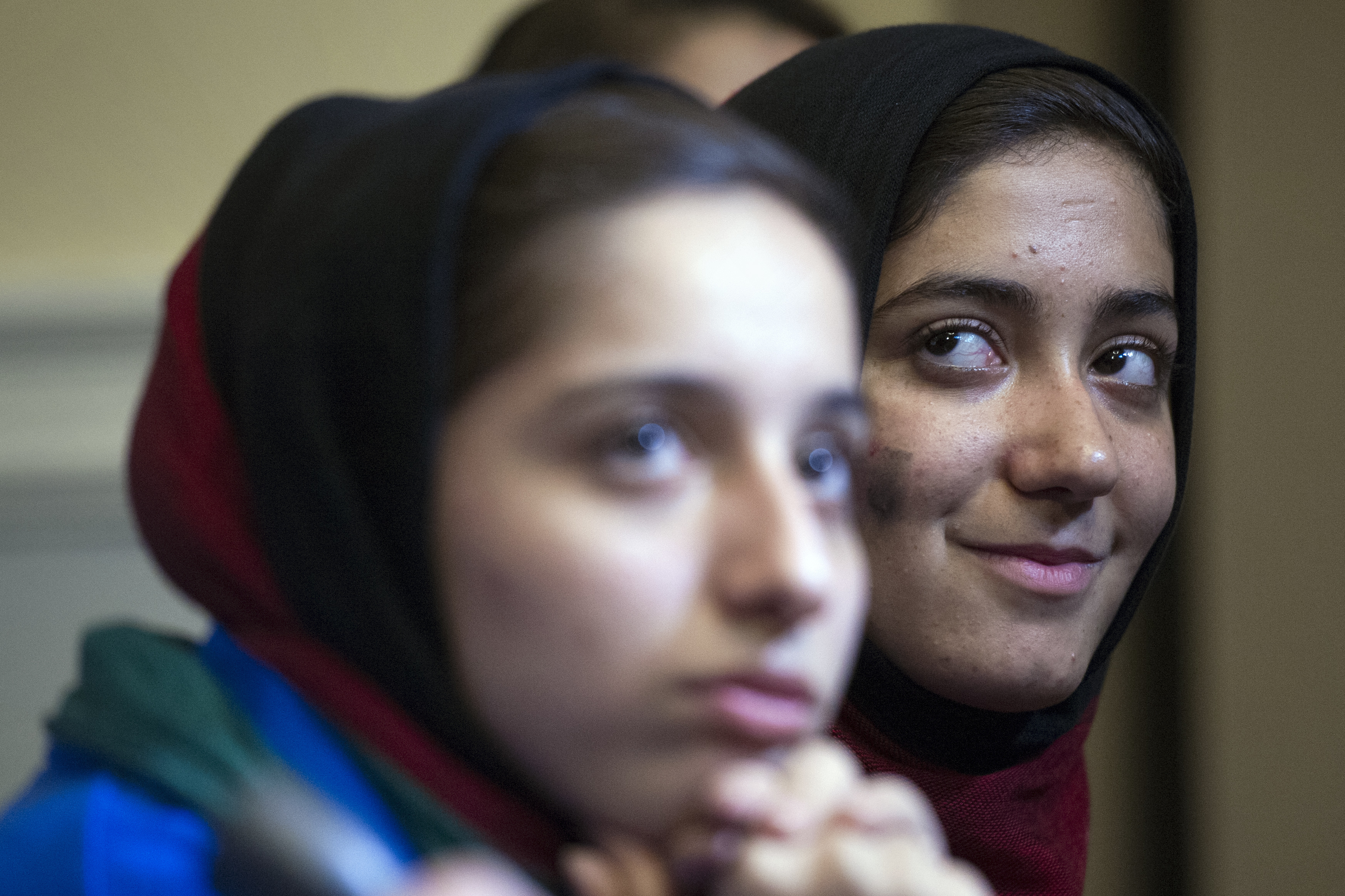 Afghanistan's FIRST Global Challenge team member Fatemah Qaderyan, left, and Rodaba Noori meet with reporters following the opening ceremony in Washington, Sunday, July 16, 2017. Twice rejected for U.S. visas, the all-girls robotics team arrived in Washington on Saturday and will compete against entrants from more than 150 countries in the three-day high school competition. It's the first annual robotics competition designed to encourage youths to pursue careers in math and science. (AP Photo/Cliff Owen)