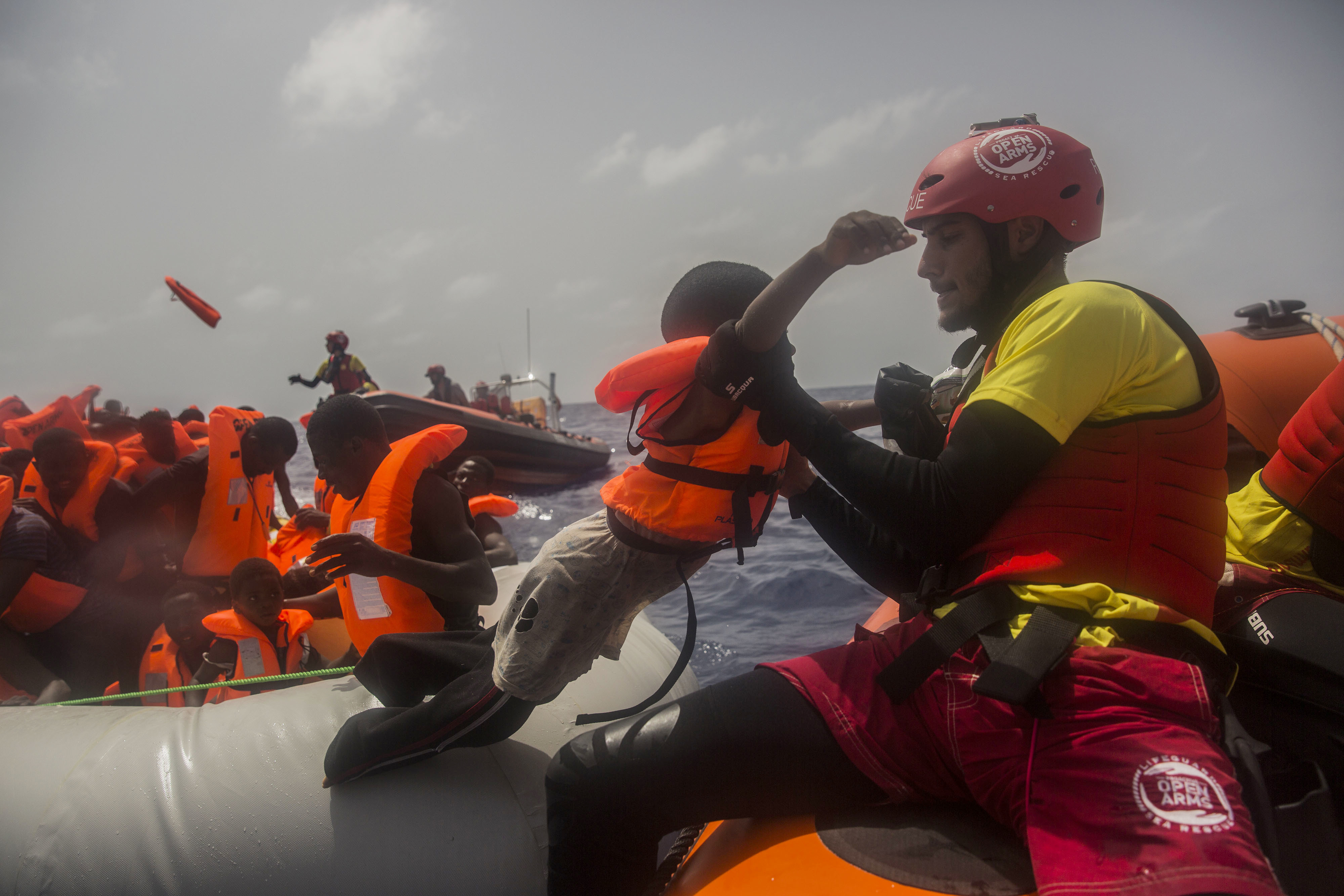 Sub saharan migrants are rescued by aid workers of Spanish NGO Proactiva Open Arms in the Mediterranean Sea, about 15 miles north of Sabratha, Libya on Tuesday, July 25, 2017. (AP Photo/Santi Palacios)
