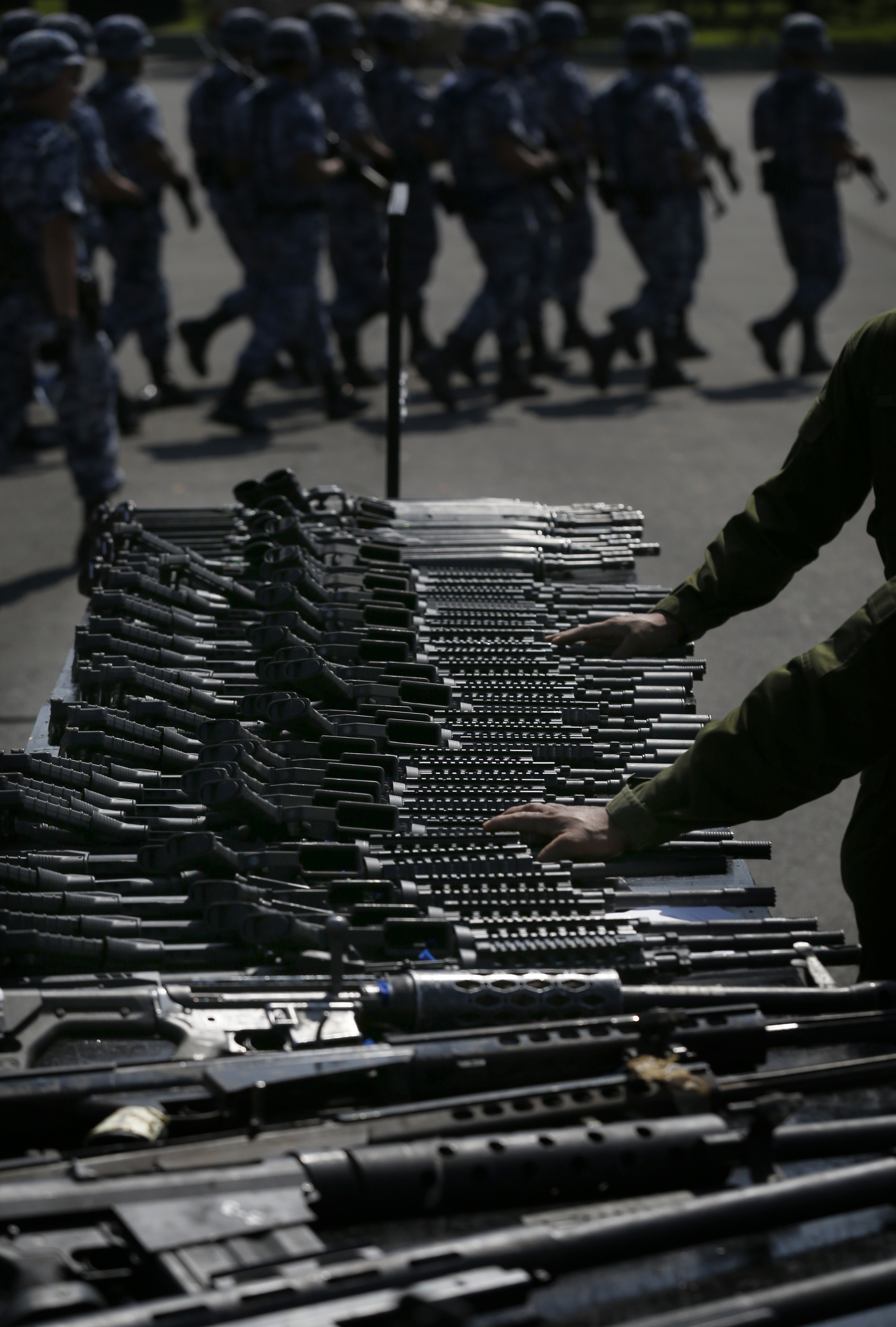 Weapons slated for destruction are displayed by the Mexican Army, in Mexico City, Tuesday, Aug. 1, 2017. The weapons were confiscated from organized crime and civilians who turned them in. (AP Photo/Marco Ugarte)