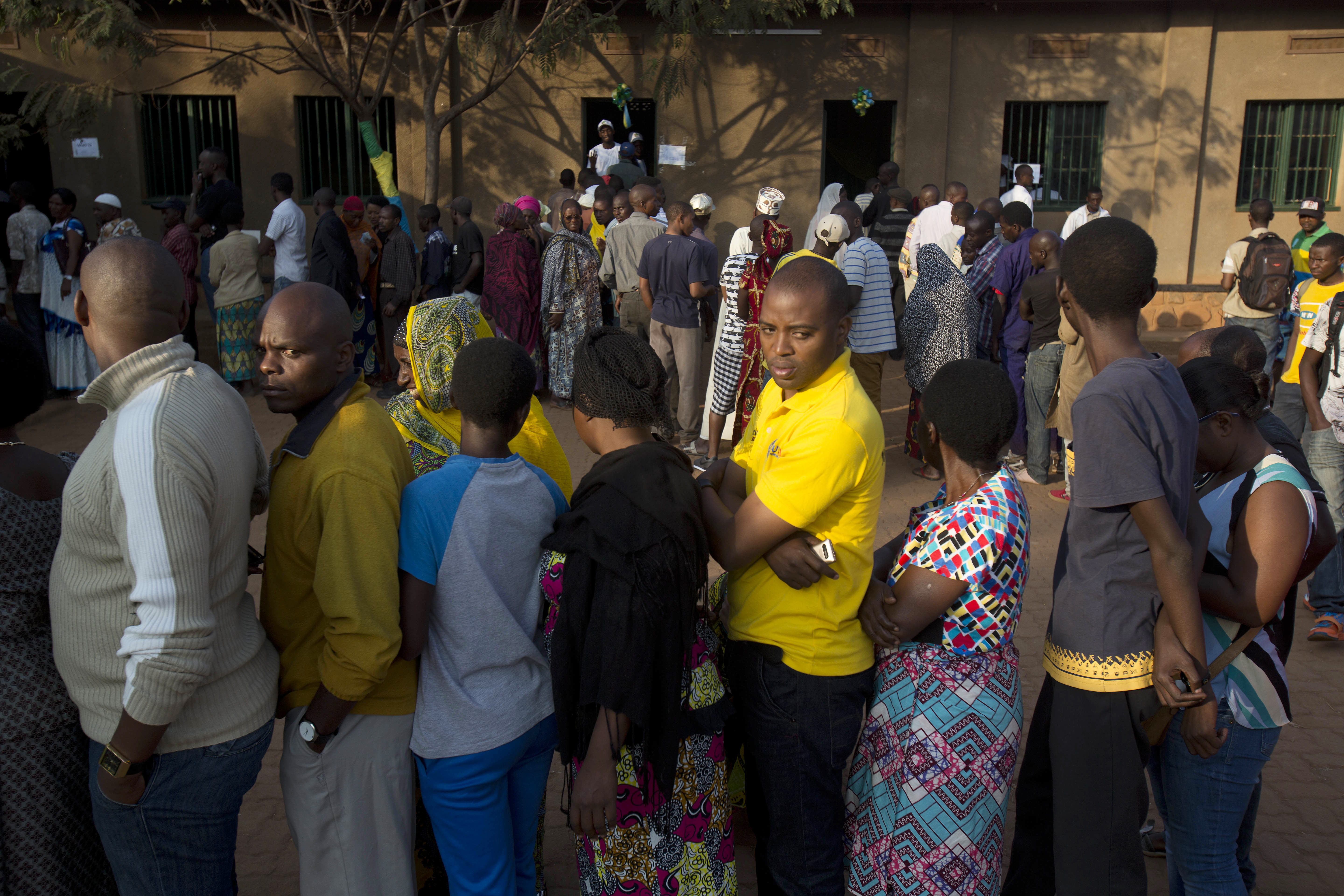 Rwandans line up to cast their vote for the presidential elections at a polling station in Rwanda's capital Kigali Friday, Aug. 4, 2017. Outgoing President Paul Kagame is widely expected to win another term after the government disqualified all but three candidates. (AP Photo/Jerome Delay)