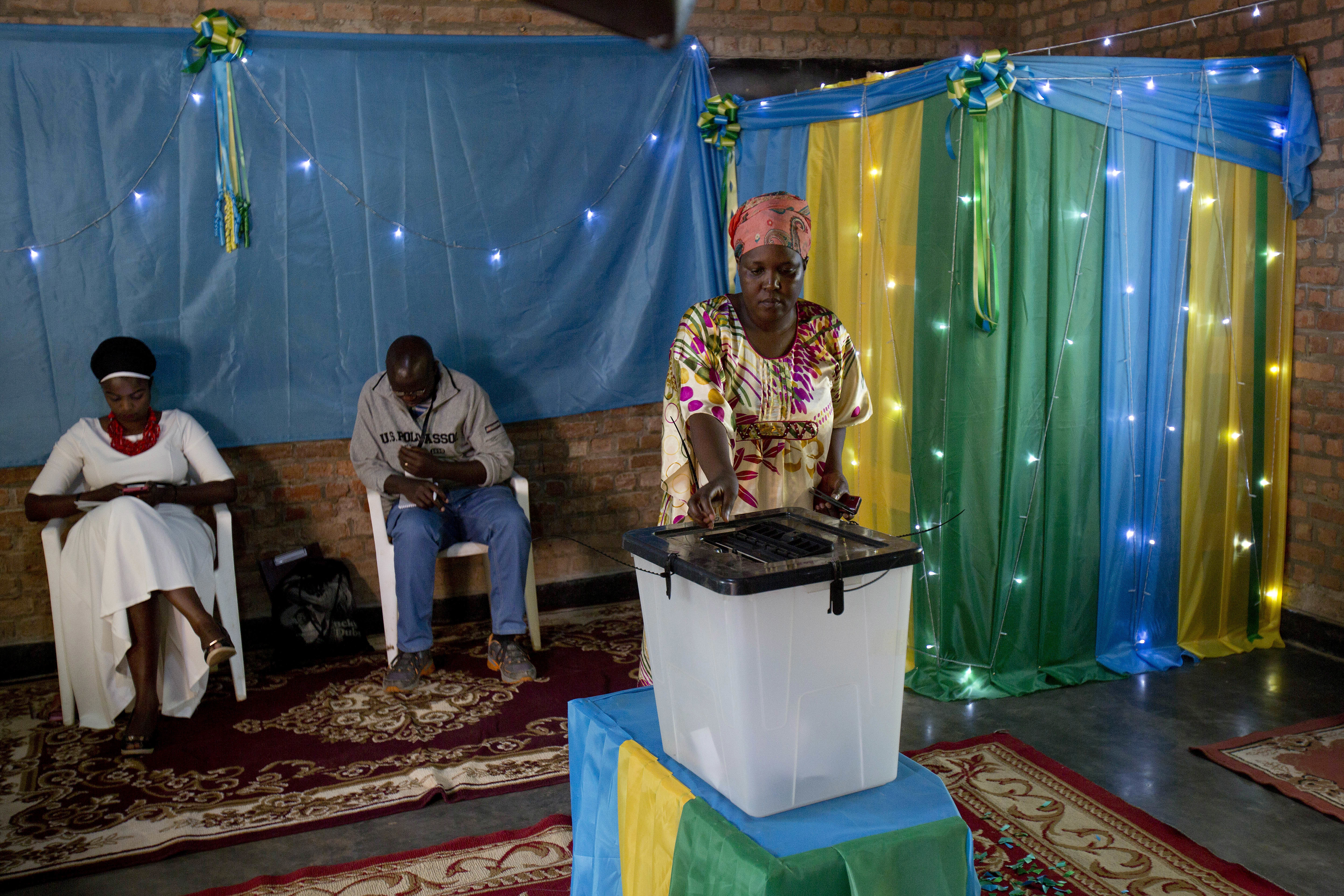 Rwandans start to vote  for the presidential elections at a polling station in Rwanda's capital Kigali Friday, Aug. 4, 2017. Outgoing President Paul Kagame is widely expected to win another term after the government disqualified all but three candidates. (AP Photo/Jerome Delay)
