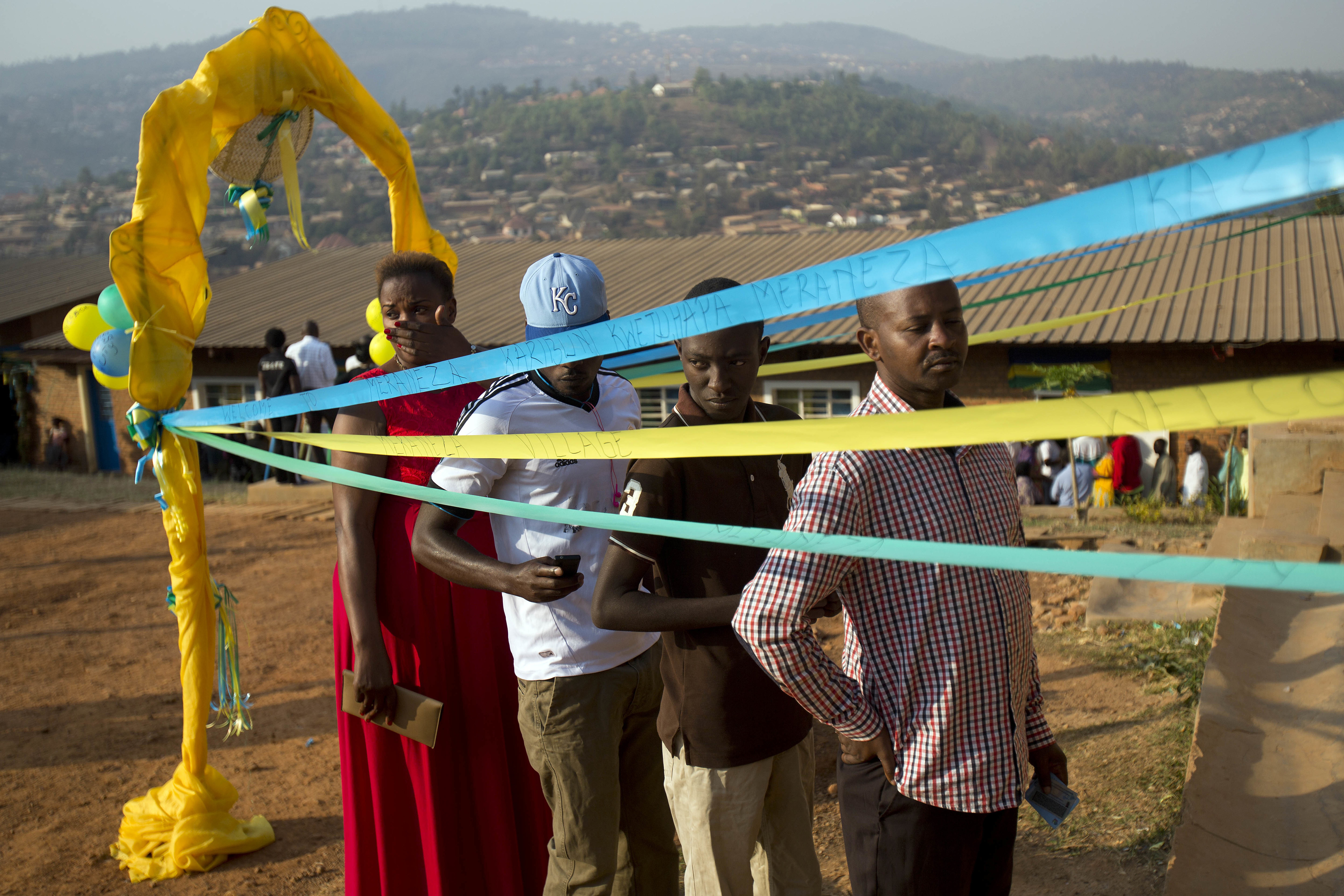 Voters line up to cast their vote at a polling station for the presidential election, Friday Aug. 4, 2017, in the capital Kigali, Rawanda. Incumbent President Paul Kagame is widely expected to win another term after the government disqualified three potential candidates for allegedly failing to fulfill certain requirements, including collecting enough signatures. (AP Photo/Jerome Delay)
