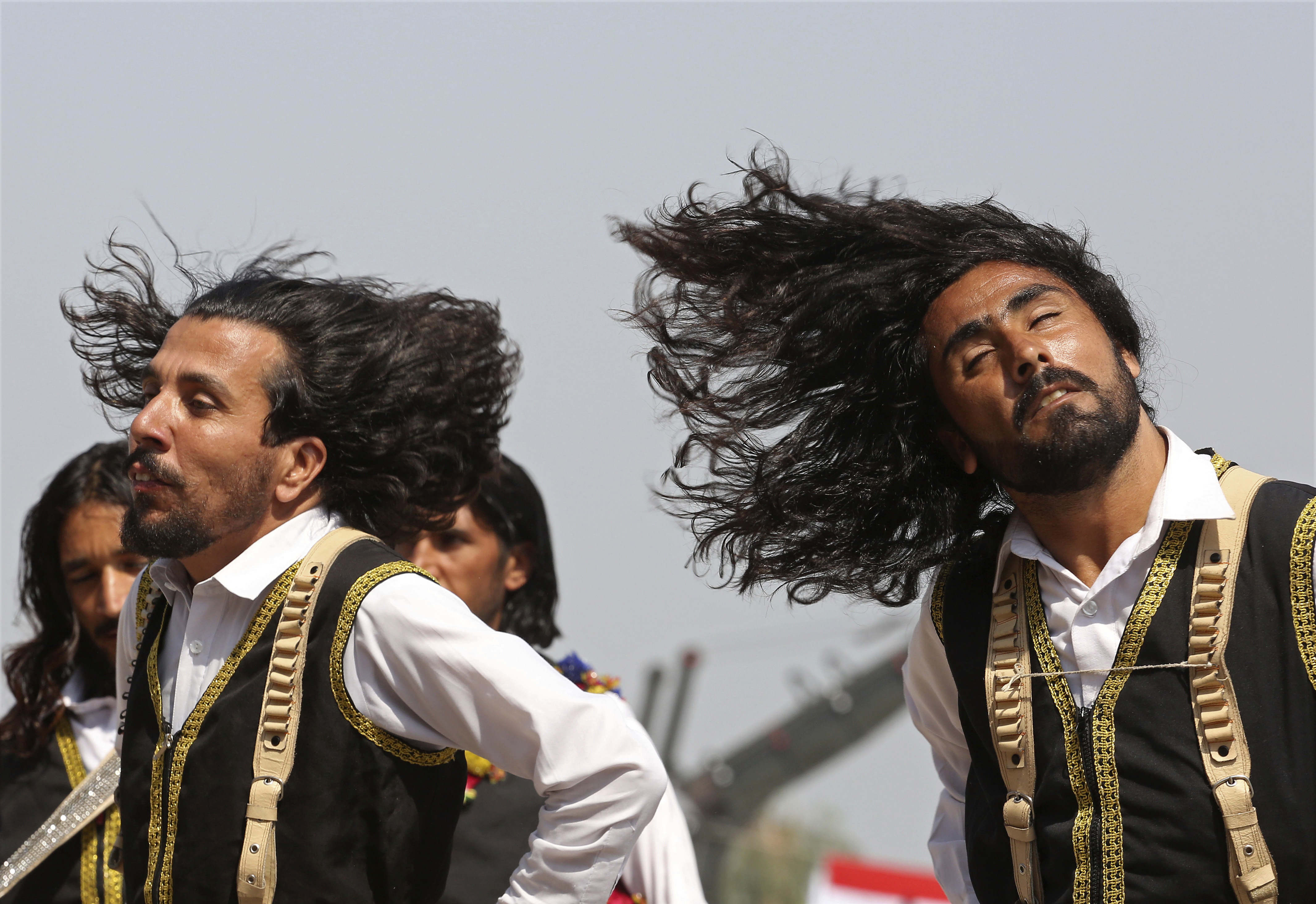 Traditional dancers perform during a ceremony to celebrate Pakistan Defense Day, marking the 1965 war with India over the disputed Kashmir region, in Peshawar, Pakistan, Wednesday, Sept. 6, 2017. (AP Photo/Muhammad Sajjad)