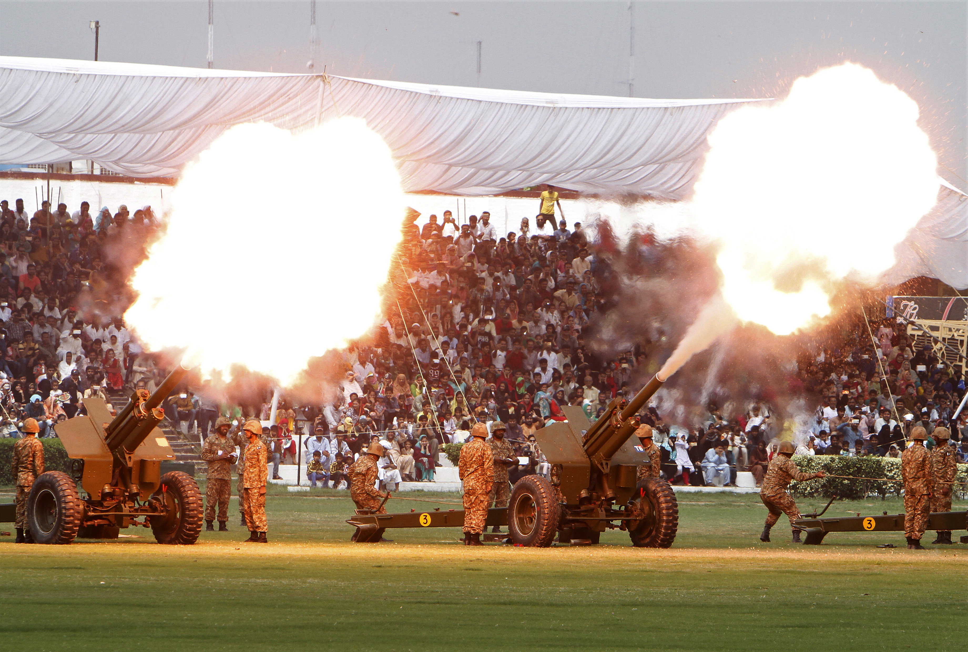 Pakistani soldiers fire canons to celebrate Pakistan Defense Day, marking the 1965 war with India over the disputed Kashmir region, in Lahore, Pakistan, Wednesday, Sept. 6, 2017. (AP Photo/K.M. Chaudary)