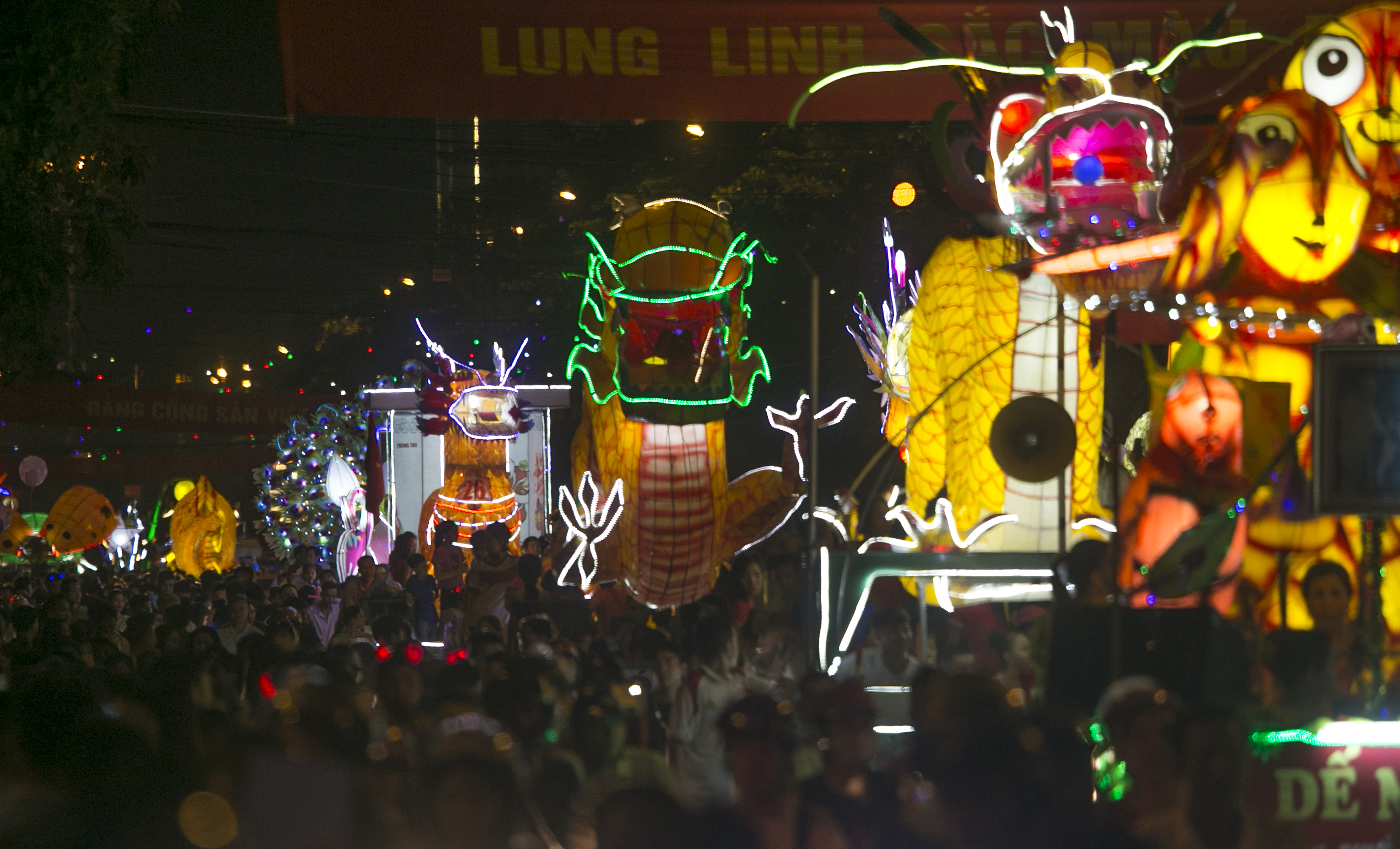 Lantern floats parade through the streets to celerbate the Mid-Autumn, or Moon festival in Tuyen Quang city, Vietnam, Monday, Oct. 2, 2017. (AP Photo/Hau Dinh)