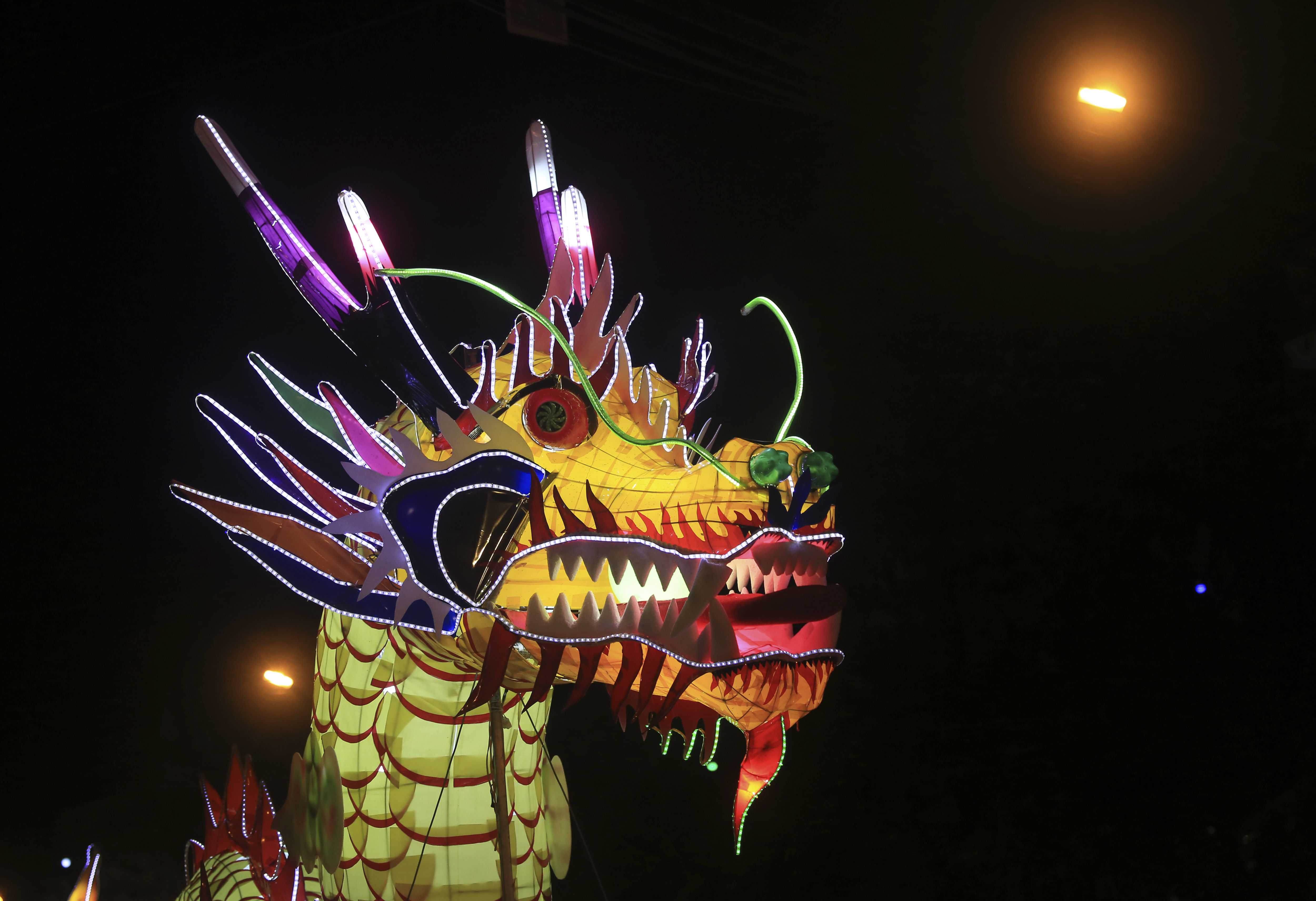 A dragon lantern parades through the streets to celebrate the Mid-Autumn, or Moon festival in Tuyen Quang city, Vietnam, Monday, Oct. 2, 2017. (AP Photo/Hau Dinh)
