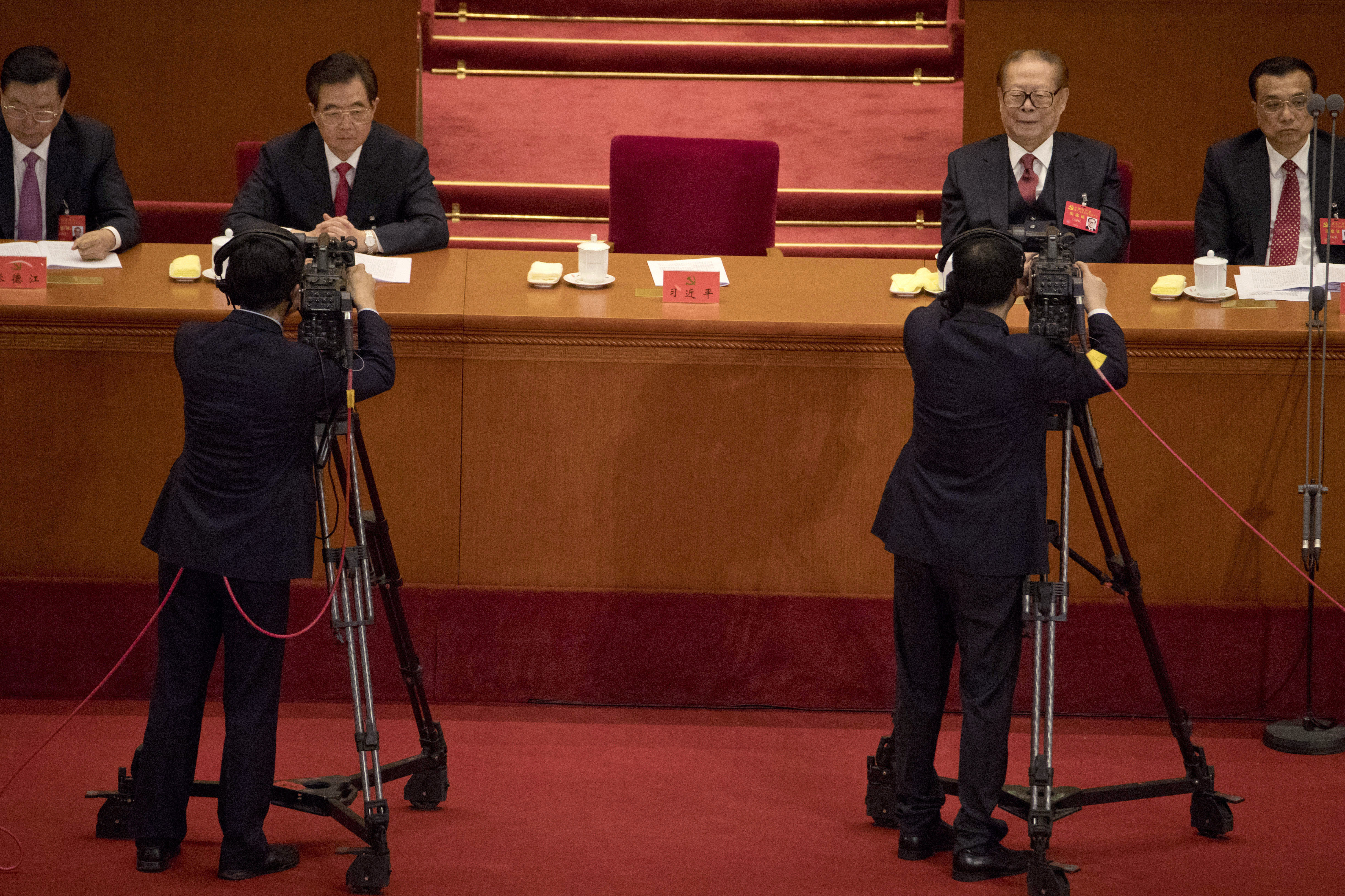 Former Chinese President Jiang Zemin, second from right, and former Chinese President Hu Jintao, second from left, attend the opening ceremony of the 19th Party Congress held at the Great Hall of the People in Beijing, China, Wednesday, Oct. 18, 2017. Chinese President Xi Jinping on Wednesday urged a reinvigorated Communist Party to take on a more forceful role in society and economic development to better address 