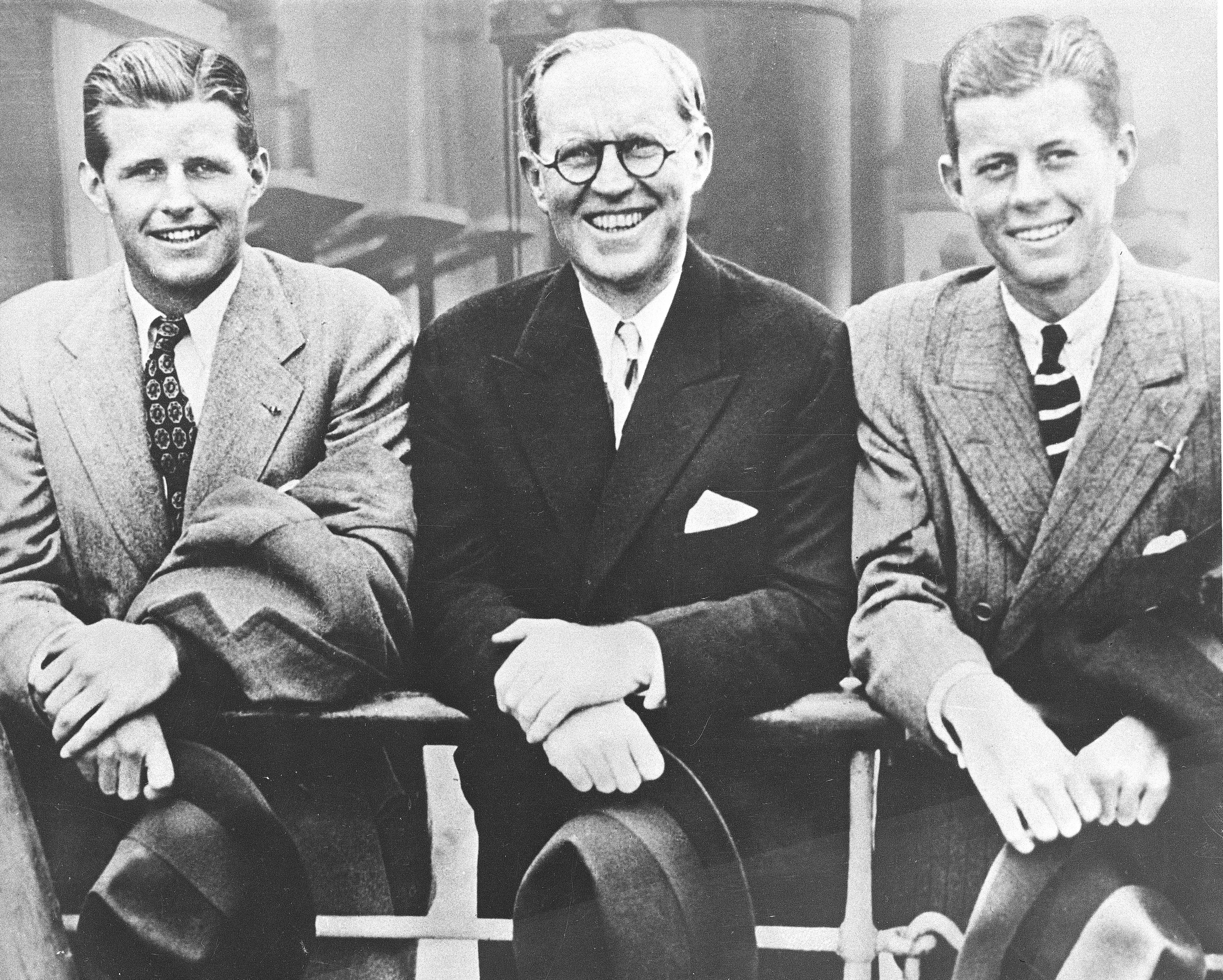 U.S. Ambassador to Great Britain Joseph P. Kennedy, center, is flanked by his sons, Joseph P. Kennedy Jr., left, and John F. Kennedy, right, as he poses aboard an ocean liner in this 1938 photograph. (AP Photo)