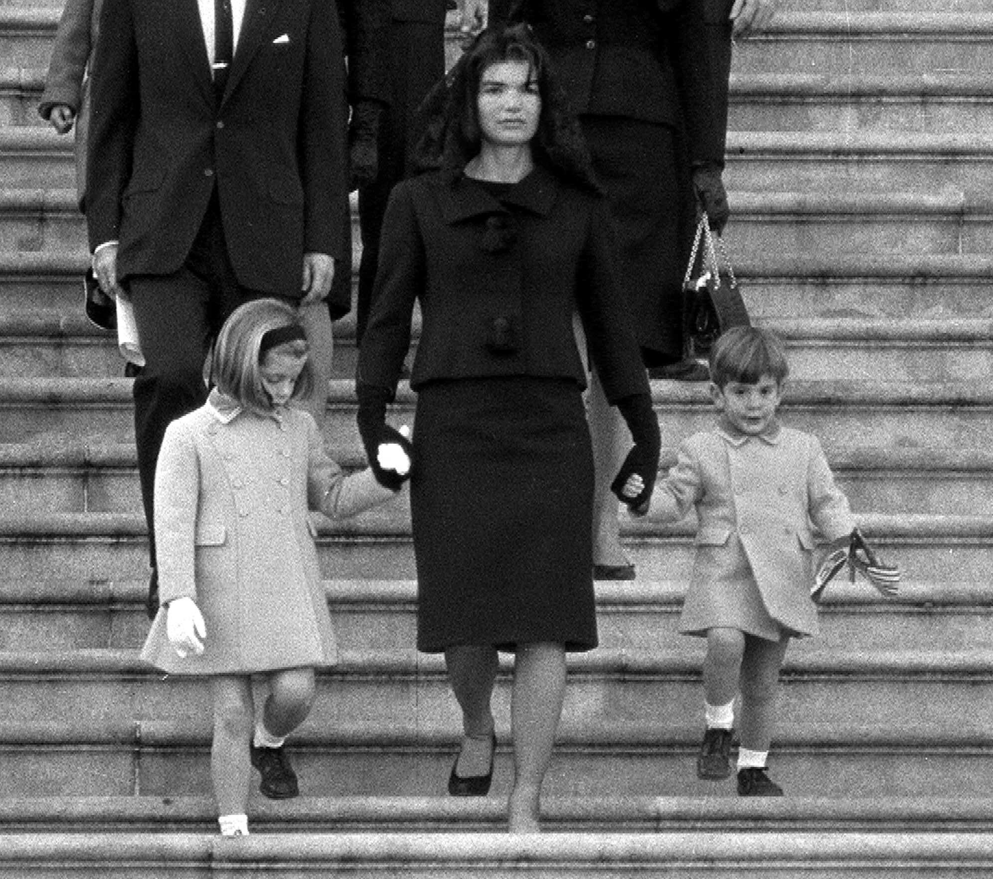 File - In this Nov. 24, 1963 file photo, Jacqueline Kennedy walks down the Capitol steps with her daughter Caroline and son John Jr. after President John. F. Kennedy's casket was placed in the rotunda in Washington Nov. 24, 1963. (AP Photo, File)