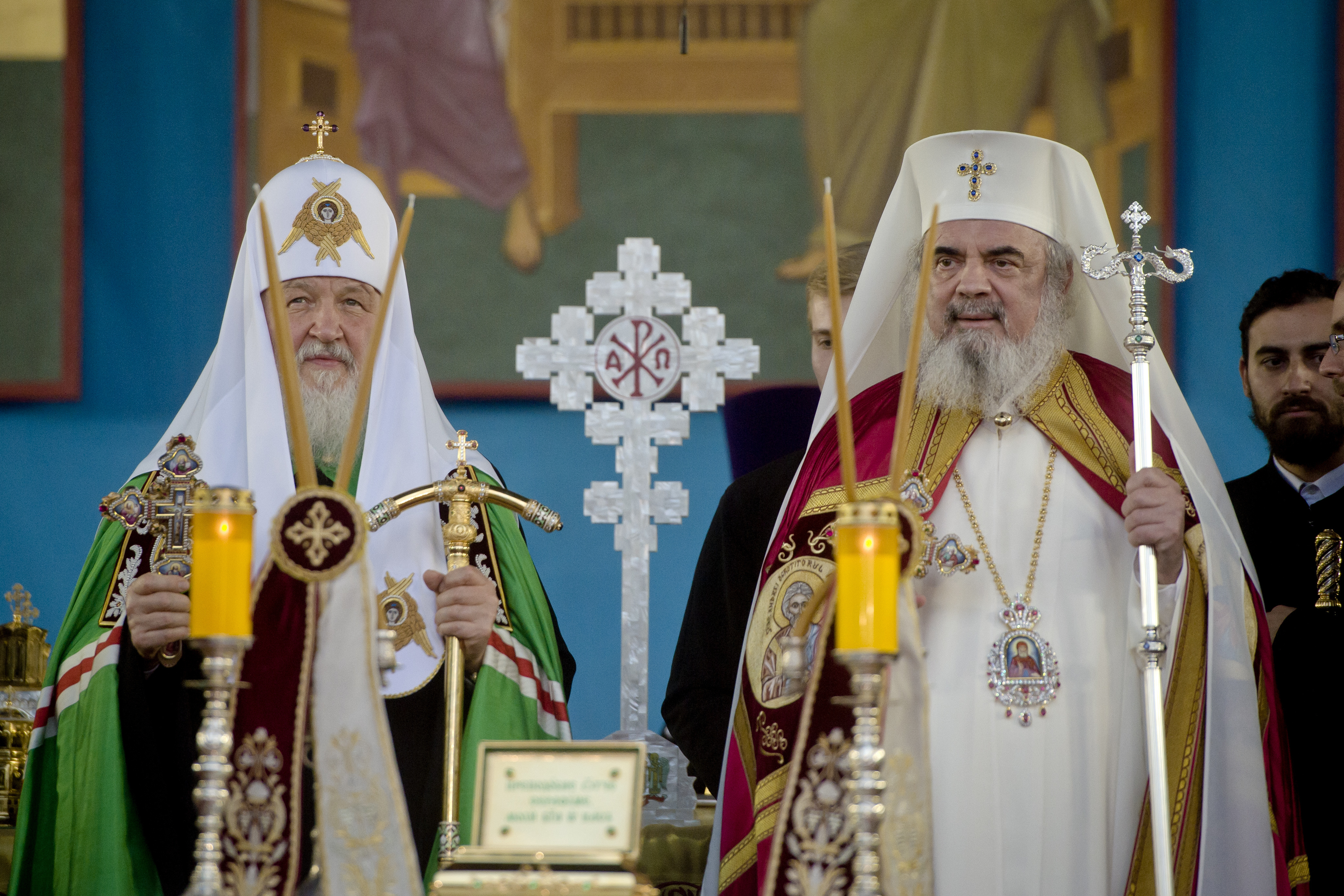 The head of the Russian Orthodox Church Patriarch Kirill, left, takes part in a religious service together with the Patriarch of Romanian Orthodox Church Daniel at the Romanian patriarchal cathedral in Bucharest, Romania, Thursday, Oct. 26, 2017. Russian Orthodox patriarch of Moscow Kirill arrived in Romania on the first visit by the head of the powerful Russian church since communism ended. (AP Photo/Andreea Alexandru)