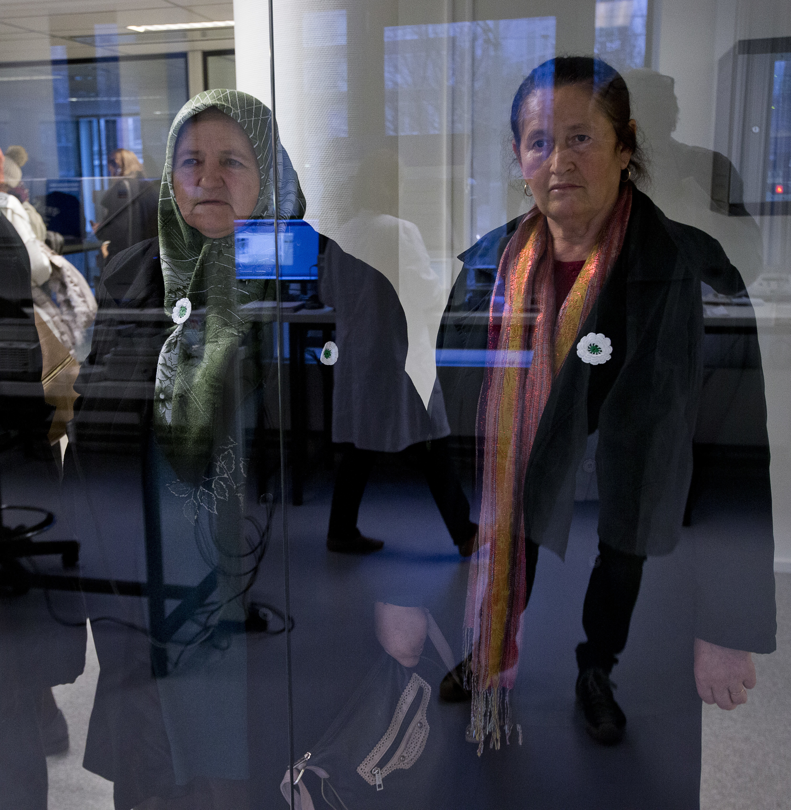 A delegation of the Mothers of Srebrenica and several other Bosnian organizations tour the DNA lab of the International Commission on Missing Persons, ICMP, in The Hague, Netherlands, Monday, Nov. 20, 2017, two days ahead of the verdict in the genocide trial against Bosnian Serb military chief Ratko Mladic at the Yugoslav War Crimes Tribunal. (AP Photo/Peter Dejong)