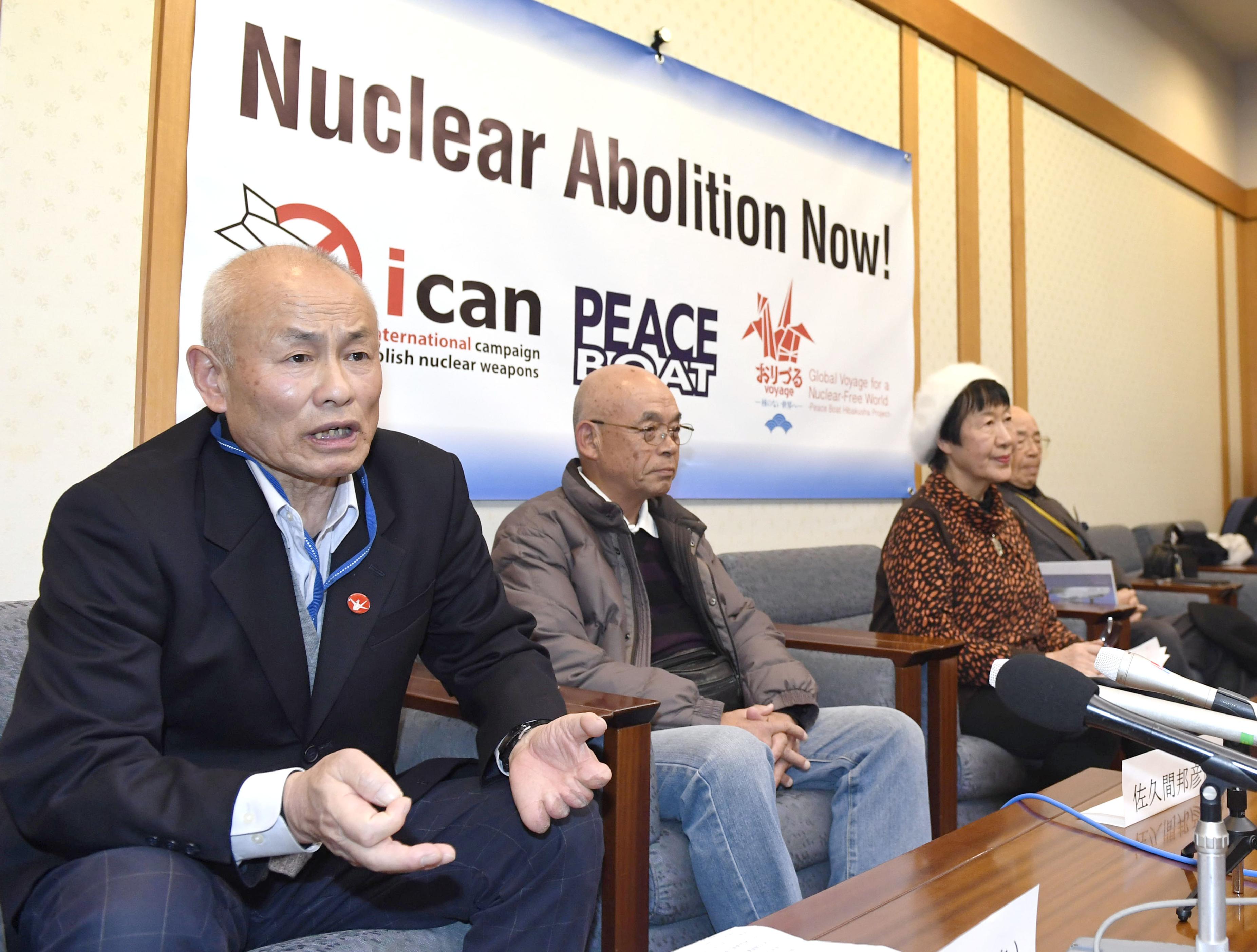 Kunihiko Sakuma (2nd from L) and Toshiyuki Mimaki (L), representatives of groups for victims and families of the 1945 U.S. atomic bombing of Hiroshima, meet the press at Narita airport near Tokyo on Dec. 7, 2017, before leaving for Oslo where the Nobel Peace Prize Award Ceremony will be held on Dec. 10. (Kyodo)
==Kyodo