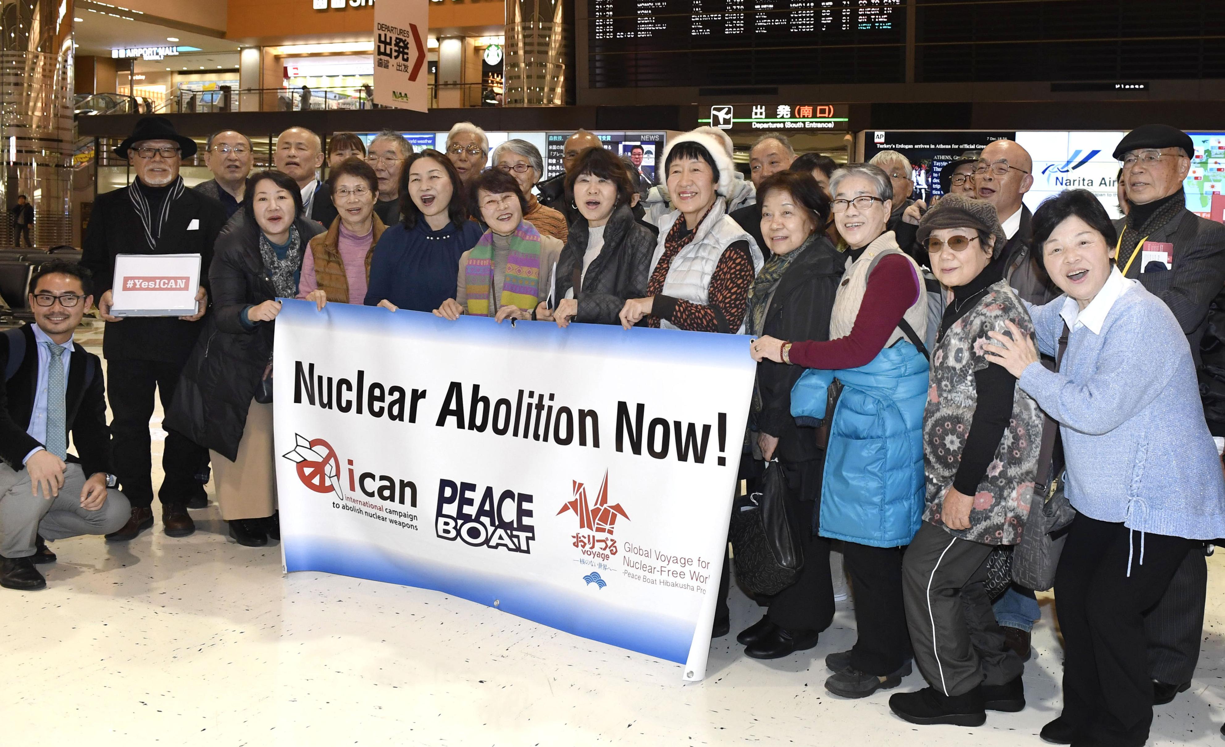 Survivors of the 1945 U.S. atomic bombings of Hiroshima and Nagasaki among others pose for photos at Narita airport near Tokyo on Dec. 7, 2017, before leaving for Oslo where the Nobel Peace Prize Award Ceremony will be held on Dec. 10. (Kyodo)
==Kyodo
