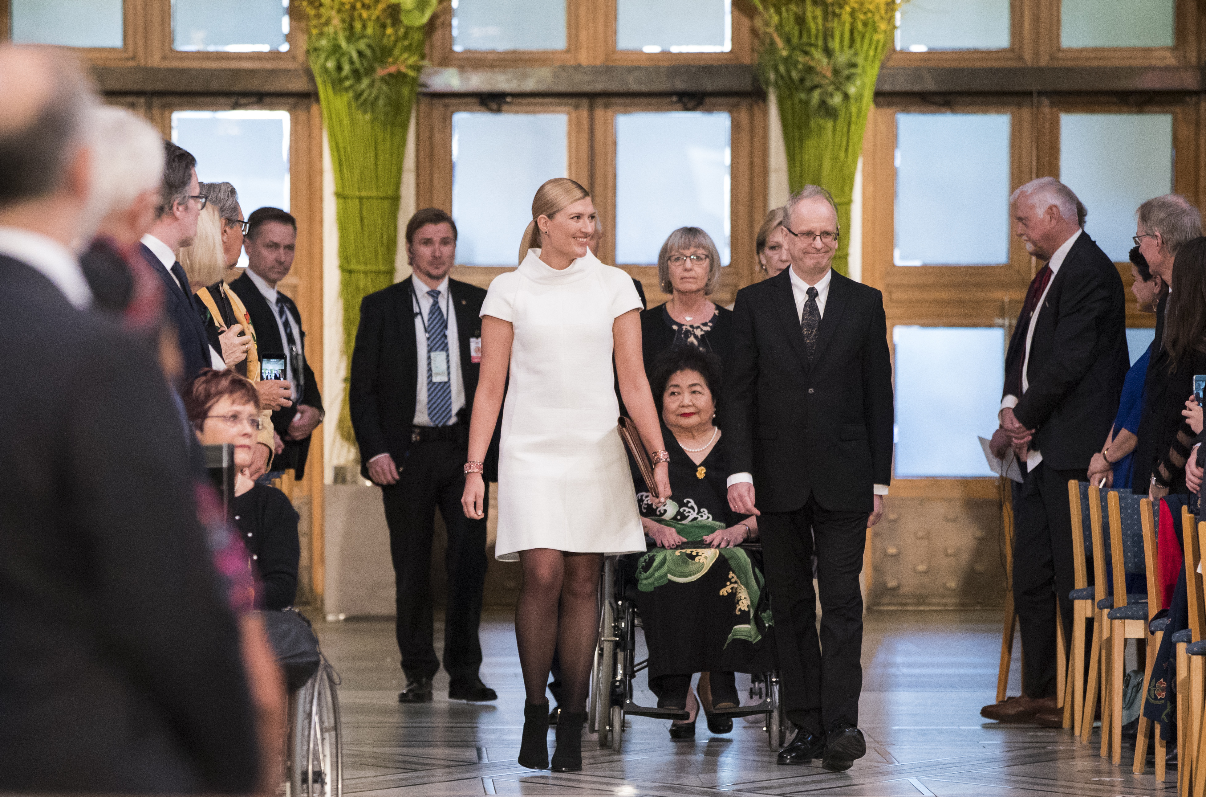 Hiroshima Survivor Setsuko Thurlow and Beatrice Fihn, leader of International Campaign to Abolish Nuclear Weapons (ICAN) in Oslo City Hall on the occasion of the award ceremony of the Nobel Peace Prize to ICAN, in Oslo, Sunday, Dec. 10, 2017. At right is Henrik Syse, member of the Nobel committee. (Berit Roald/NTB Scanpix via AP)