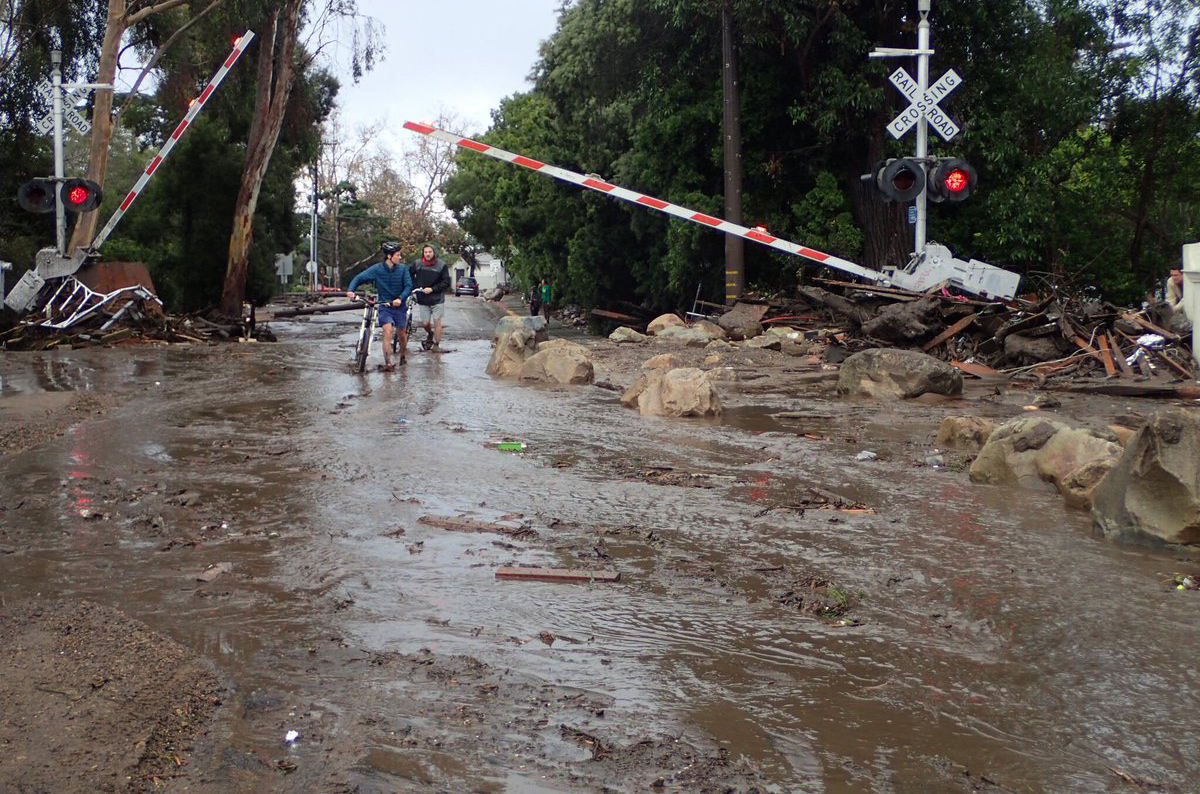 In this photo provided by Santa Barbara County Fire Department, the main line of the Union Pacific Railroad through Montecito, Calif, is blocked with mudflow and debris due to heavy rains on Tuesday, Jan. 9, 2018. Several homes were swept away before dawn Tuesday when mud and debris roared into neighborhoods in Montecito from hillsides stripped of vegetation during a recent wildfire. (Mike Eliason/Santa Barbara County Fire Department via AP)