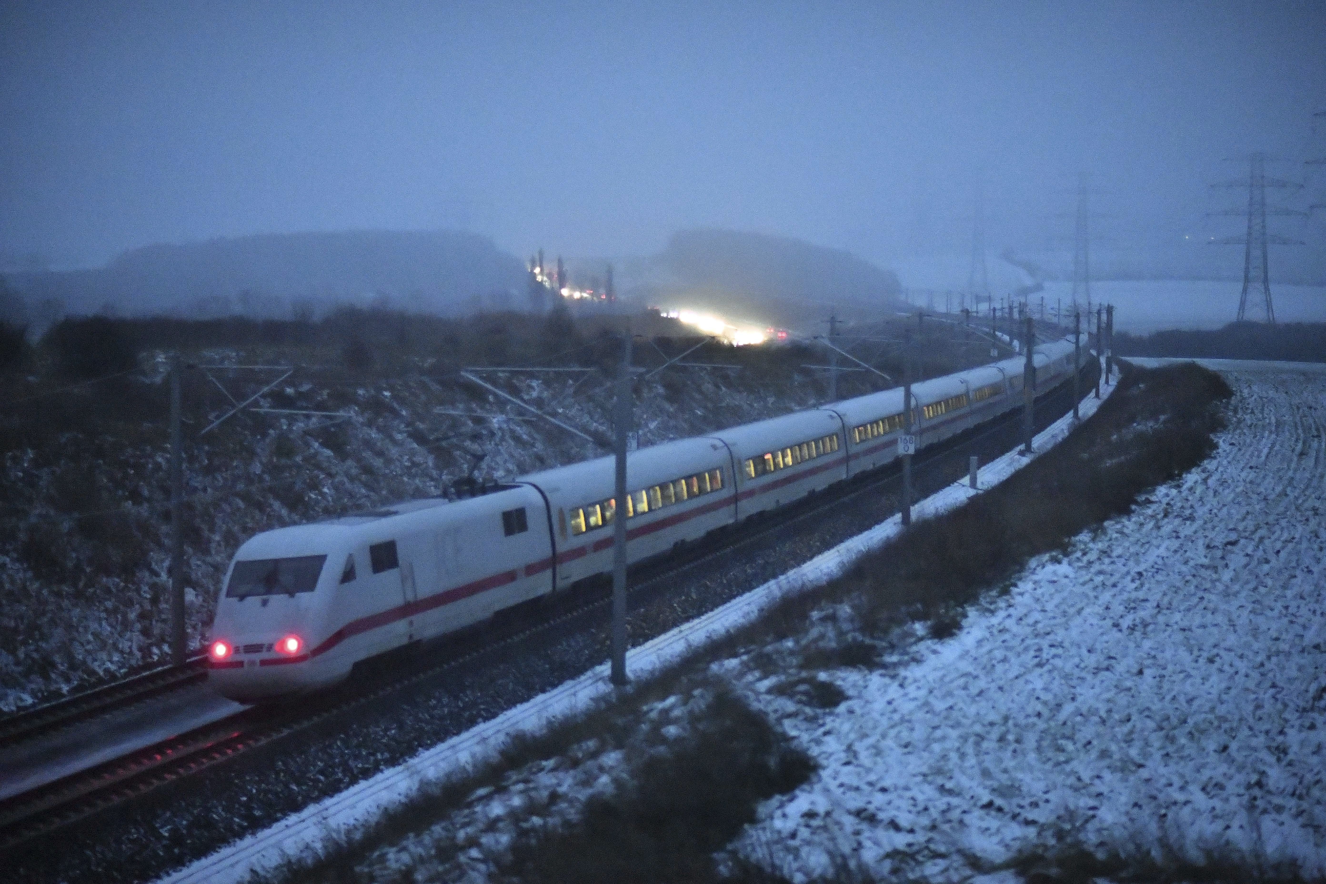 An ICE train of the German railways drives past on the newly built route between Erfurt and Nuremberg, near Arnstadt, Germany, 18 January 2018. The German railways have issued a warning regarding the storm 