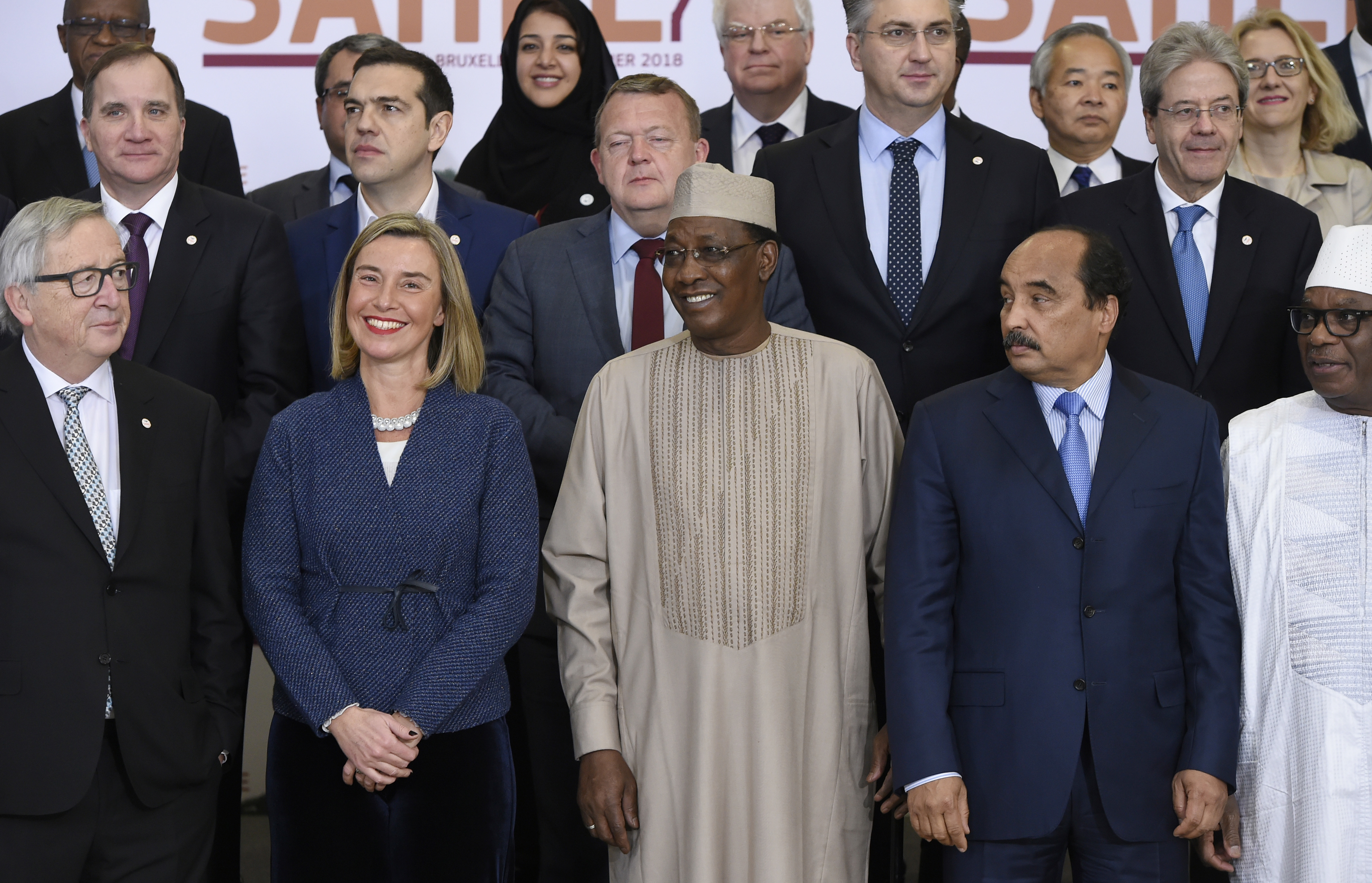 European Union foreign policy chief Federica Mogherini, front row second left, and Chad's President Idriss Deby, front row center, stand with EU and Sahel leaders during a group photo at an EU-Sahel meeting at EU headquarters in Brussels on Friday, Feb. 23, 2018. European Union leaders meet Friday with counterparts from Africa's Sahel in a show of support for the impoverished region fallen prey to extremists and a key transit point for migrants heading to Europe. (John Thys, Pool Photo via AP)