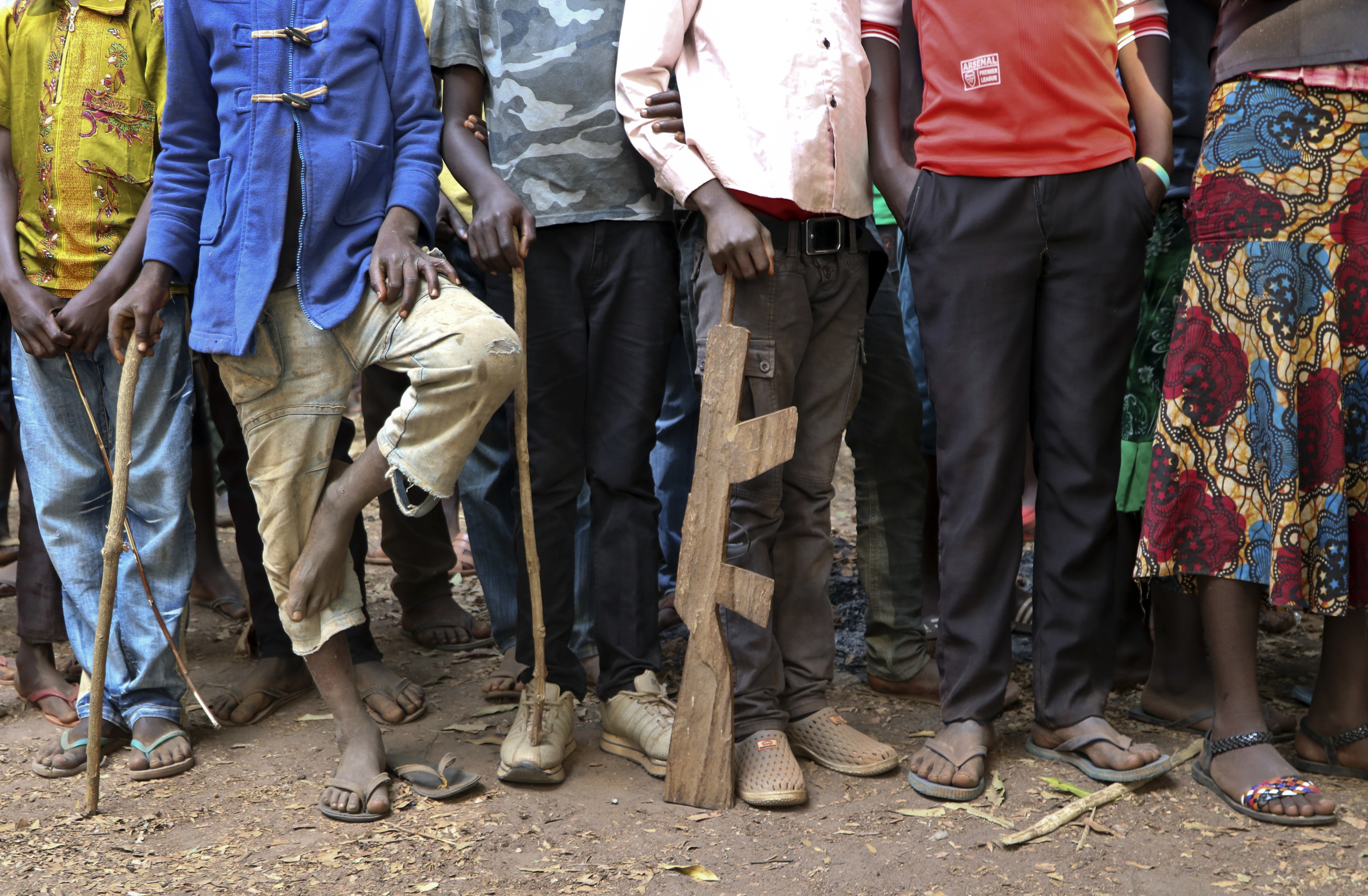 Former child soldiers stand in line waiting to be registered with UNICEF to receive a release package, in Yambio, South Sudan Wednesday, Feb. 7, 2018. More than 300 child soldiers were released Wednesday by armed groups in South Sudan, the second-largest such release since civil war began five years ago. (AP Photo/Sam Mednick)