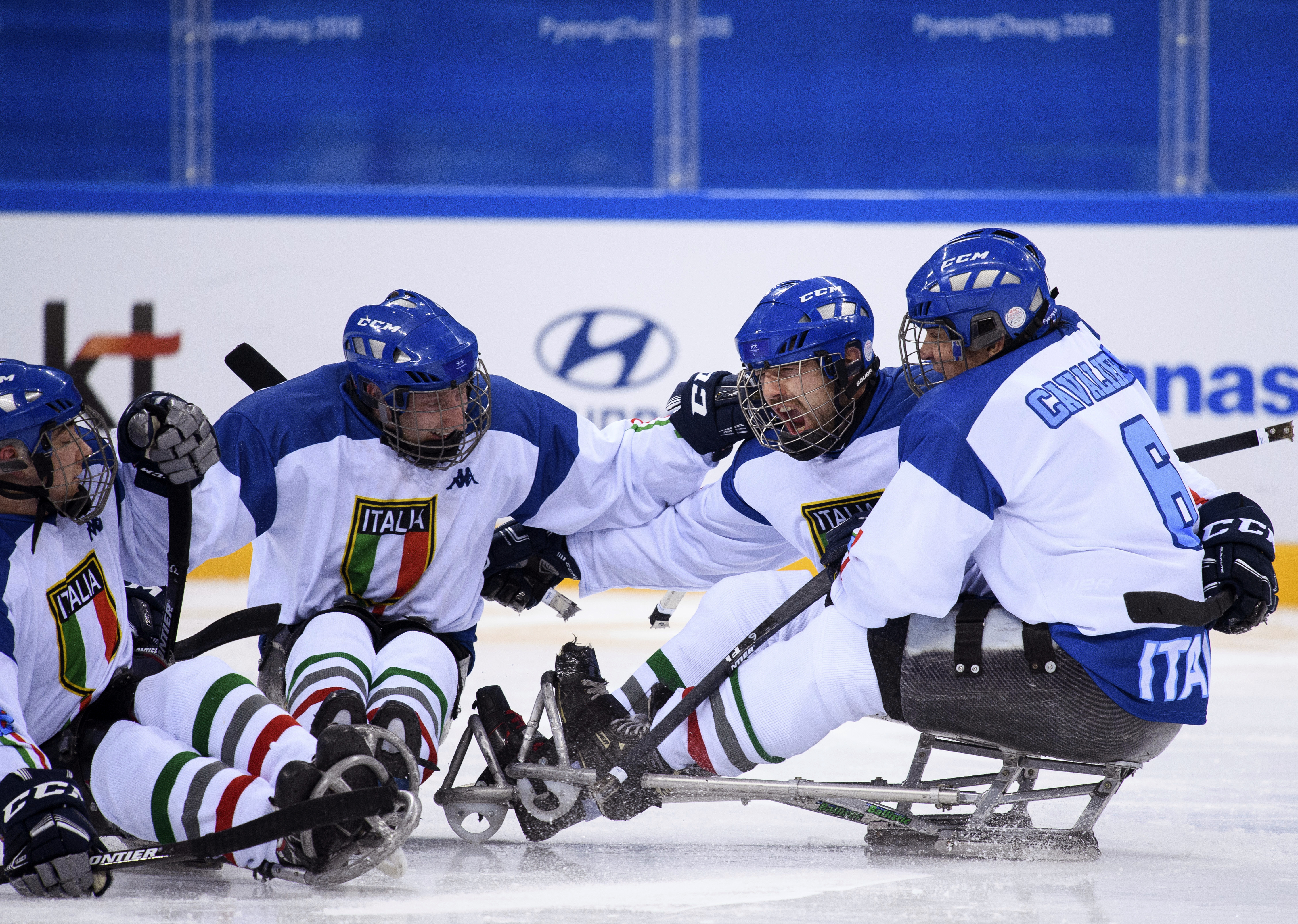 Italy's team players celebrate after scoring during the Ice Hockey Group A Preliminary Game between Norway and Italy at the Gangneung Hockey Centre at the Paralympic Winter Games in Pyeongchang, South Korea, Saturday, March 10, 2018. (Joel Marklund/OIS/IOC via AP)