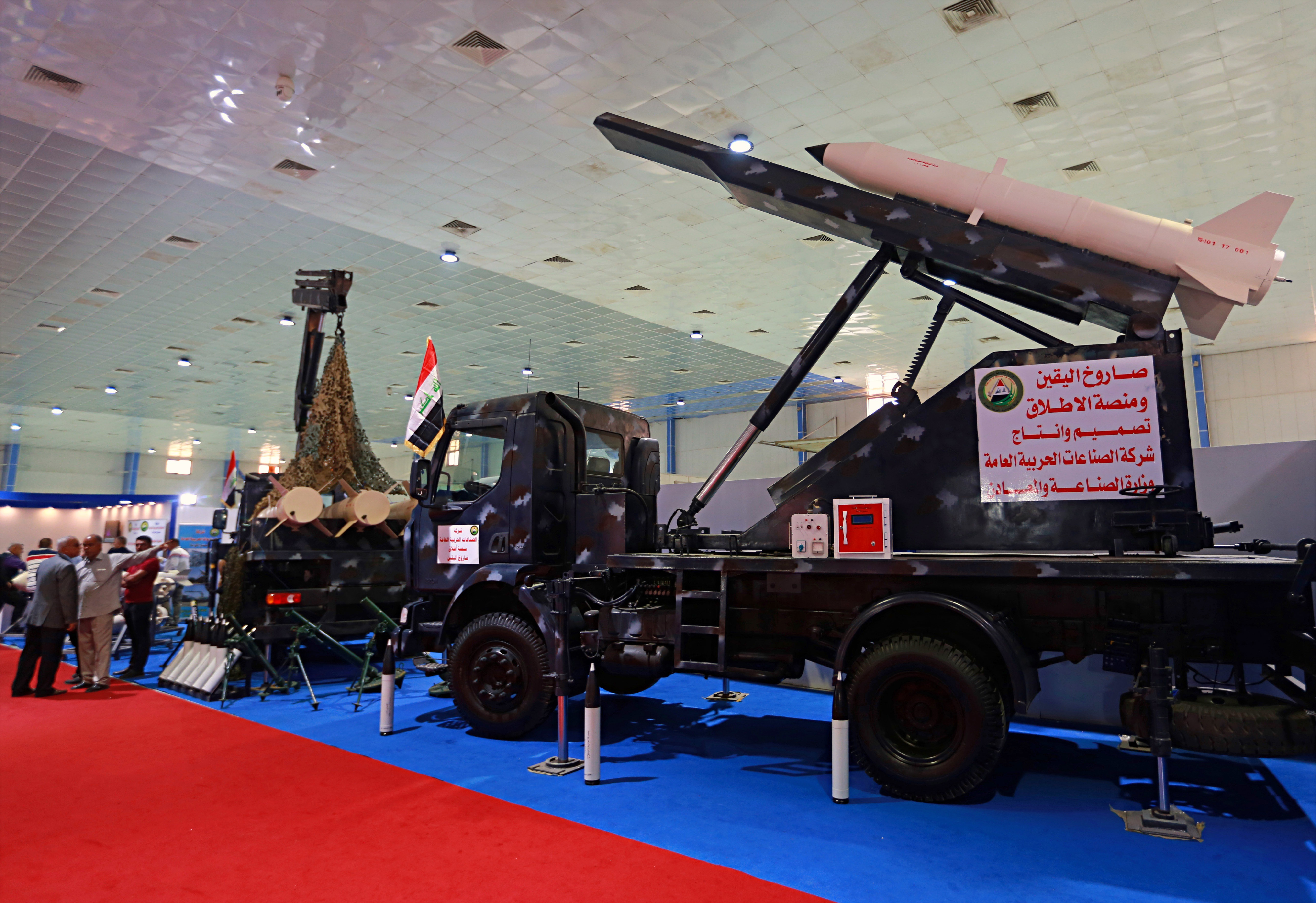 Rockets and launchers manufactured by Iraqi factories for military production are on display in the Iraqi section of the seventh annual weapons exhibition organized by the Iraqi ministry of defense at the Baghdad International Fairgrounds, Iraq, Tuesday, March, 13, 2018. (AP Photo/Khalid Mohammed)