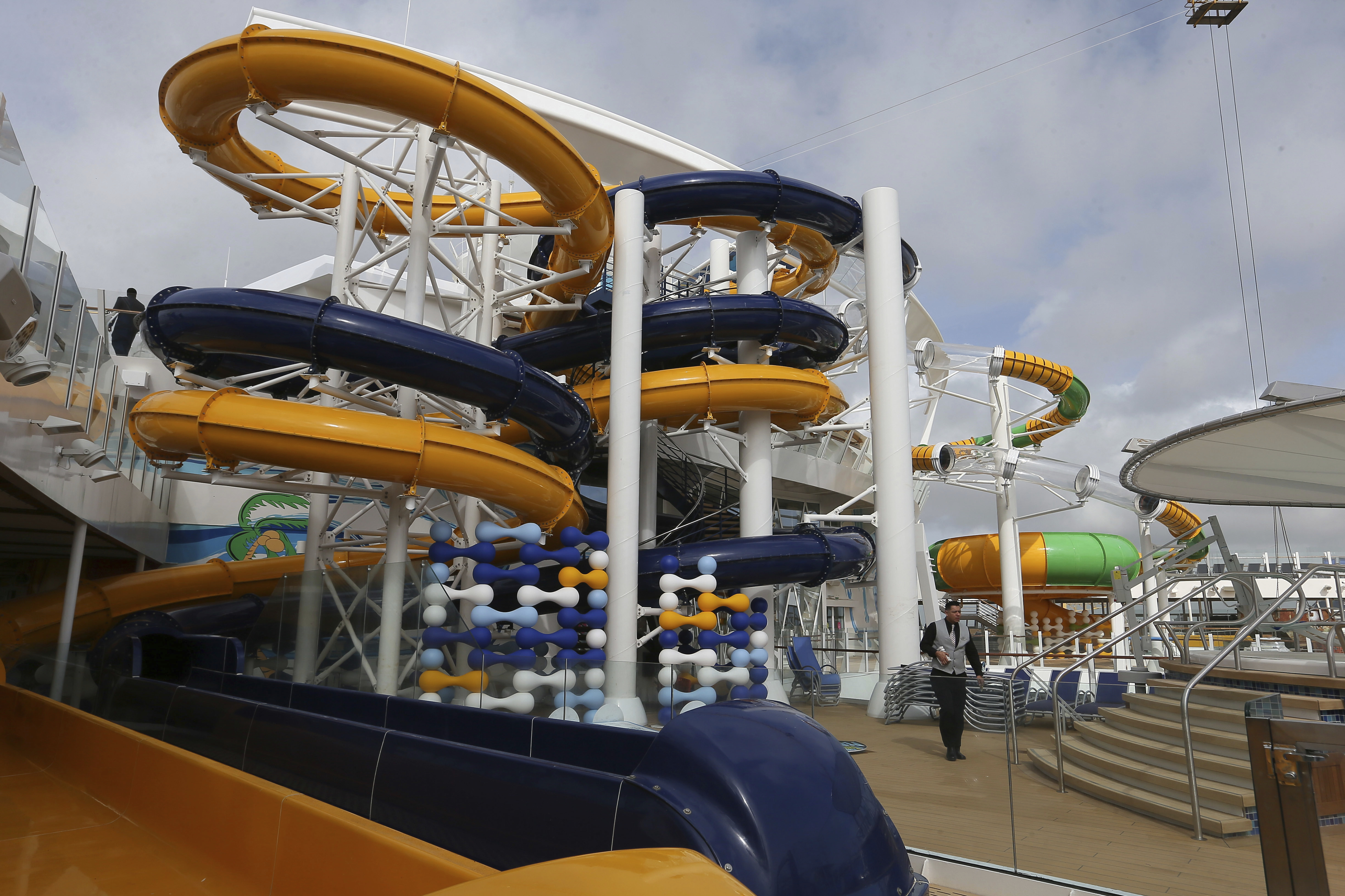 Games at the swimming pool aboard The Symphony of the Seas, the world's largest cruise ship, docking at Saint Nazaire port, western France, Friday, March 23, 2018. Royal Caribbean International took delivery of the much-awaited, 228,081-ton Symphony of the Seas from the French shipyard STX. (AP Photo/David Vincent)