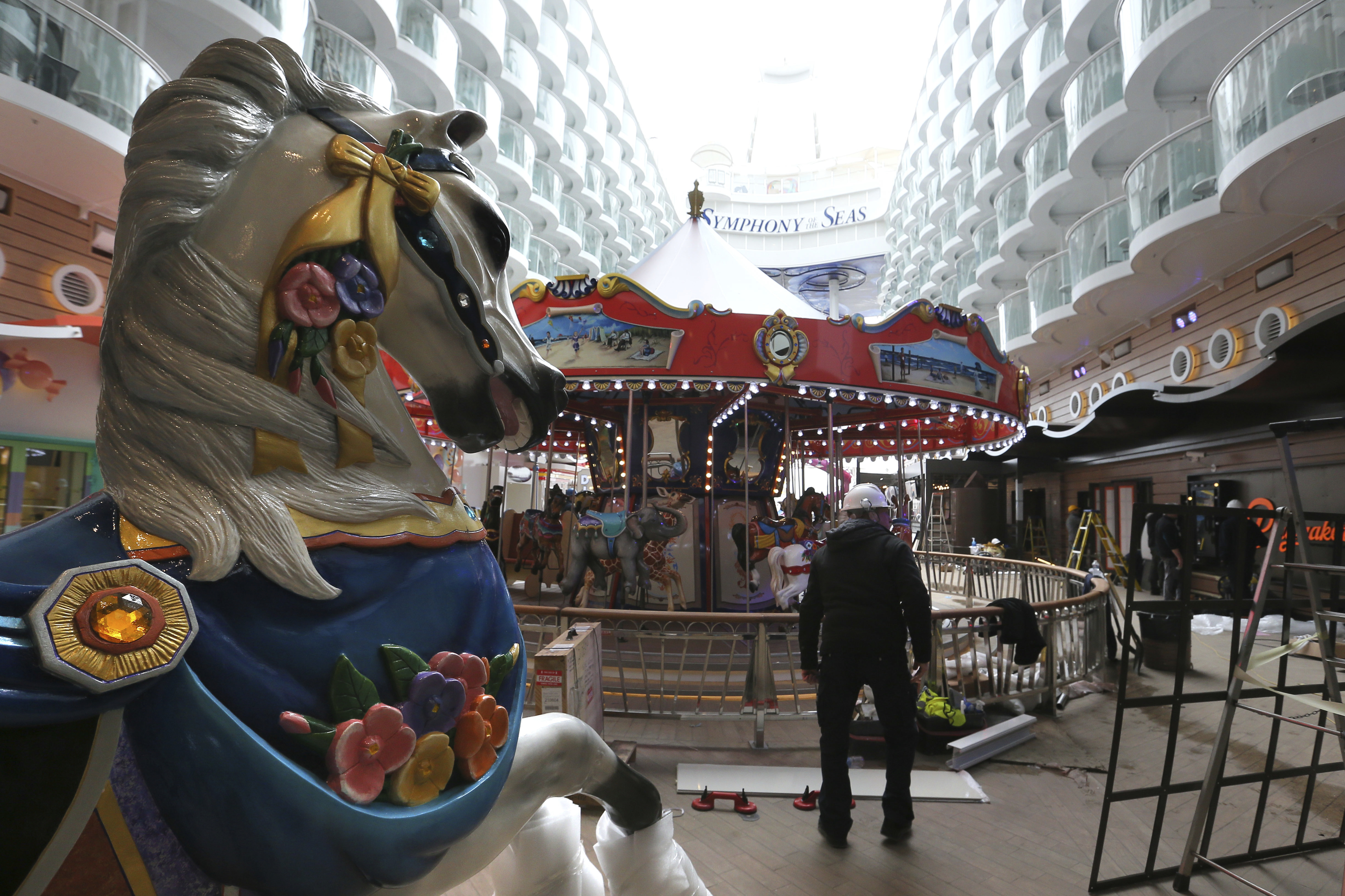 A carousel is pictured aboard The Symphony of the Seas docking at Saint Nazaire port, western France, Friday, March 23, 2018. Royal Caribbean International took delivery of the much-awaited, 228,081-ton Symphony of the Seas from the French shipyard STX. (AP Photo/David Vincent)
