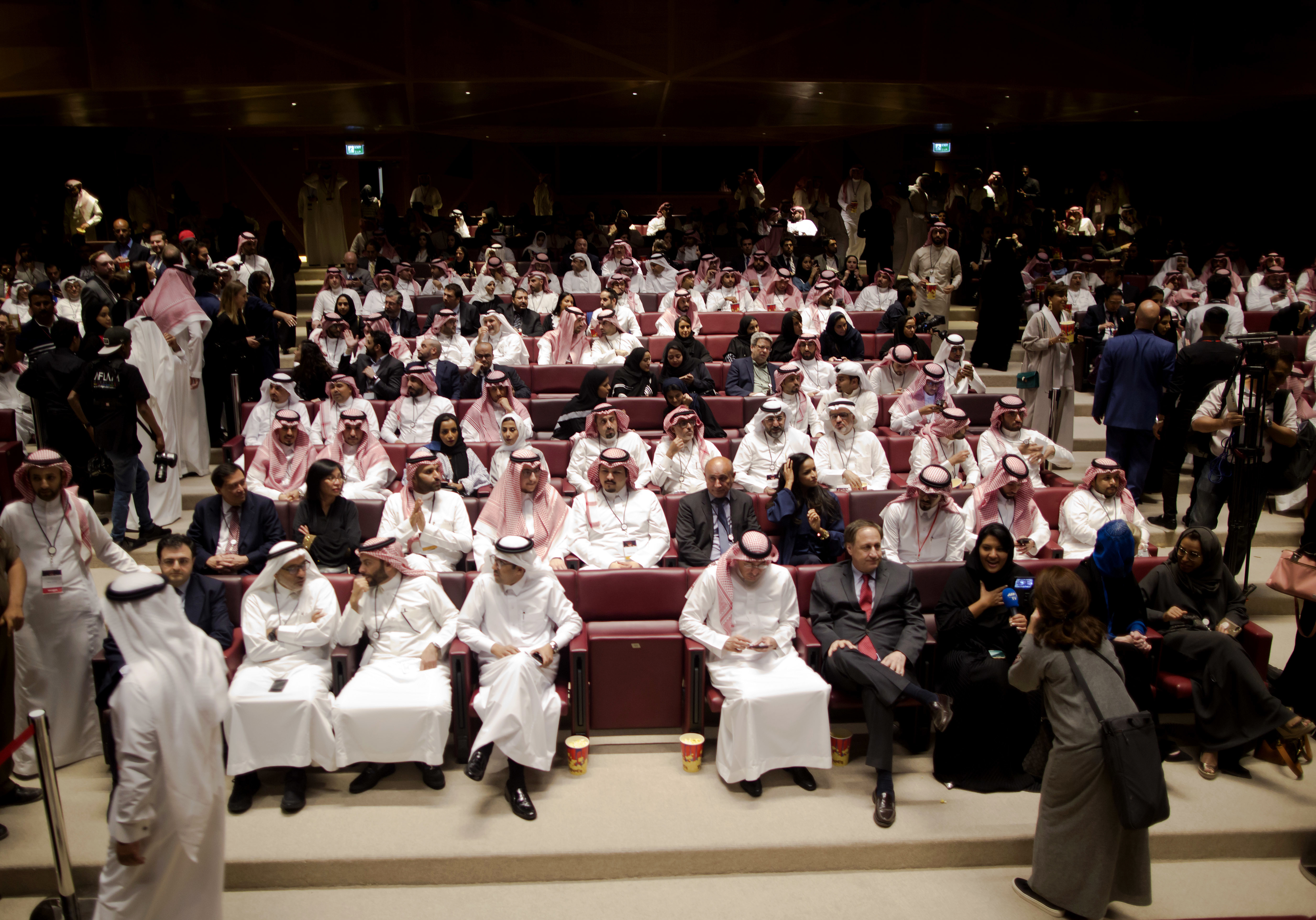 Visitors attend a cinema theatre during an invitation-only screening, at the King Abdullah Financial District Theater, in Riyadh, Saudi Arabia, Wednesday, April 18, 2018. Saudi Arabia held a private screening of the Hollywood blockbuster 