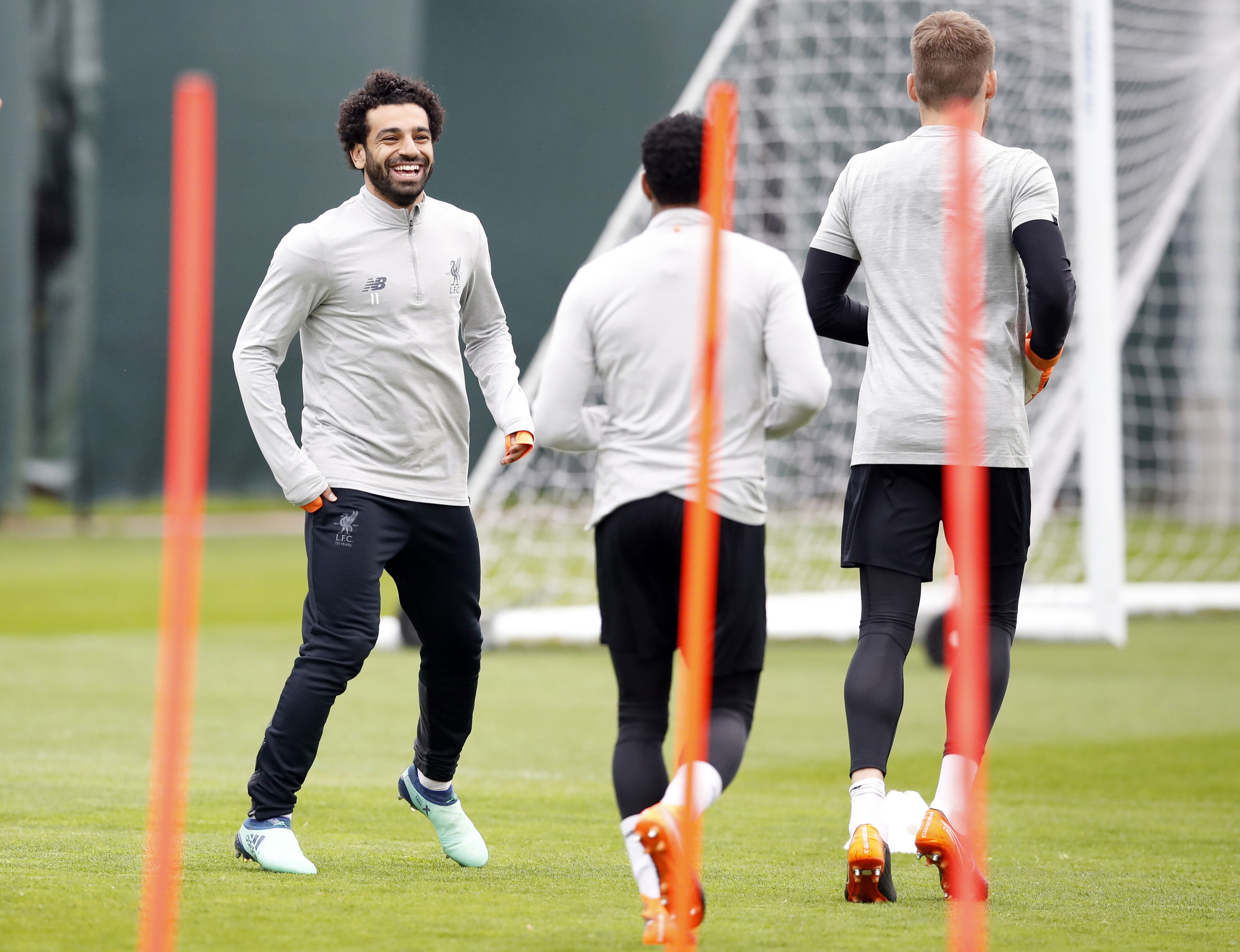Liverpool's Mohamed Salah (left) with team mates during a training session at Melwood Training Ground, Liverpool. PRESS ASSOCIATION Photo. Picture date: Monday April 23, 2018. See PA story SOCCER Liverpool. Photo credit should read: Martin Rickett/PA Wire