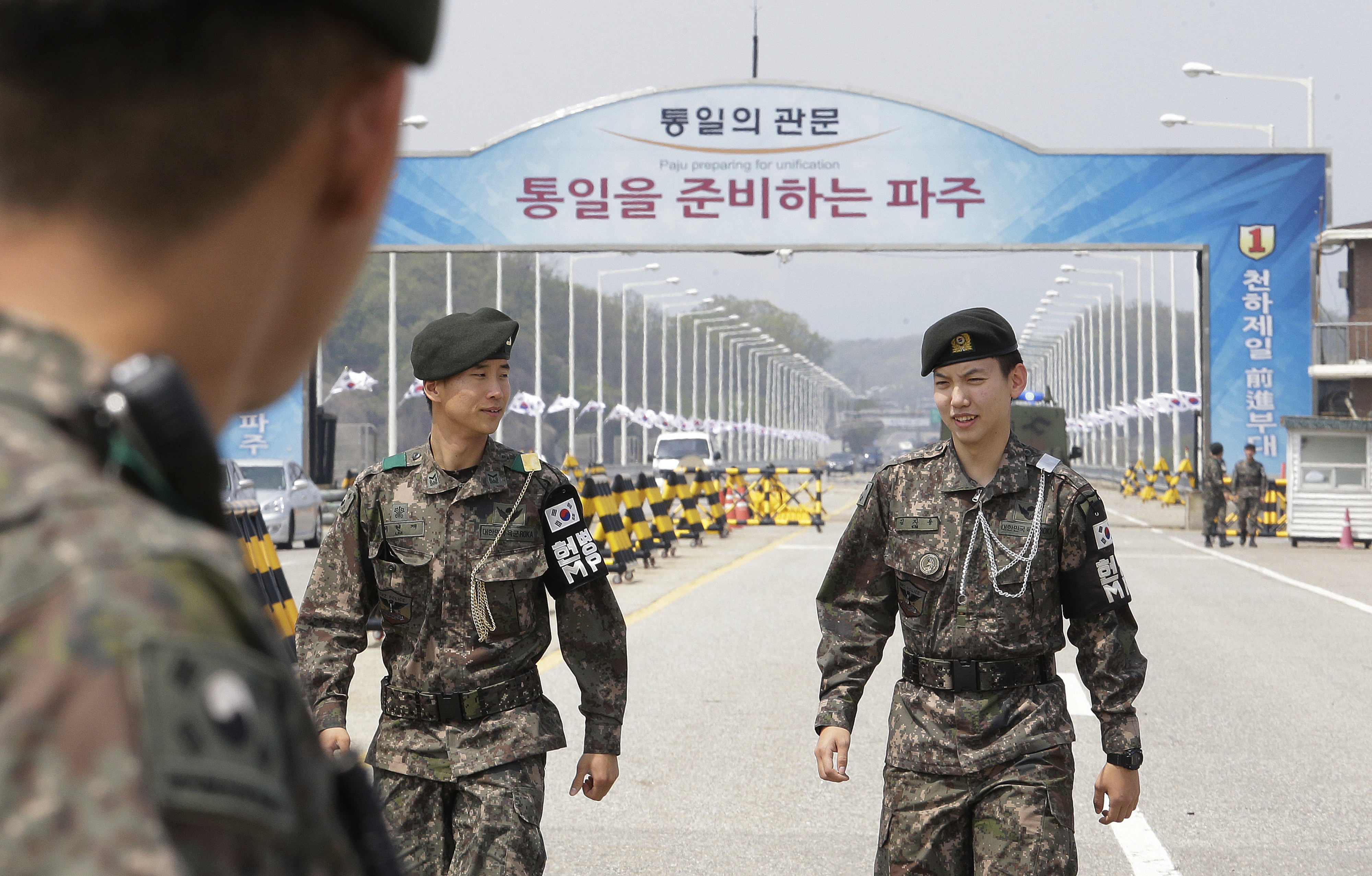 South Korean army soldiers patrol at Unification Bridge, which leads to Panmunjom in Paju, South Korea, Thursday, April 26, 2018. North Korean leader Kim Jong Un and South Korean President Moon-Jae-in will plant a commemorative tree and inspect an honor guard together after Kim walks across the border Friday for their historic summit, Seoul officials said Thursday. (AP Photo/Ahn Young-joon)