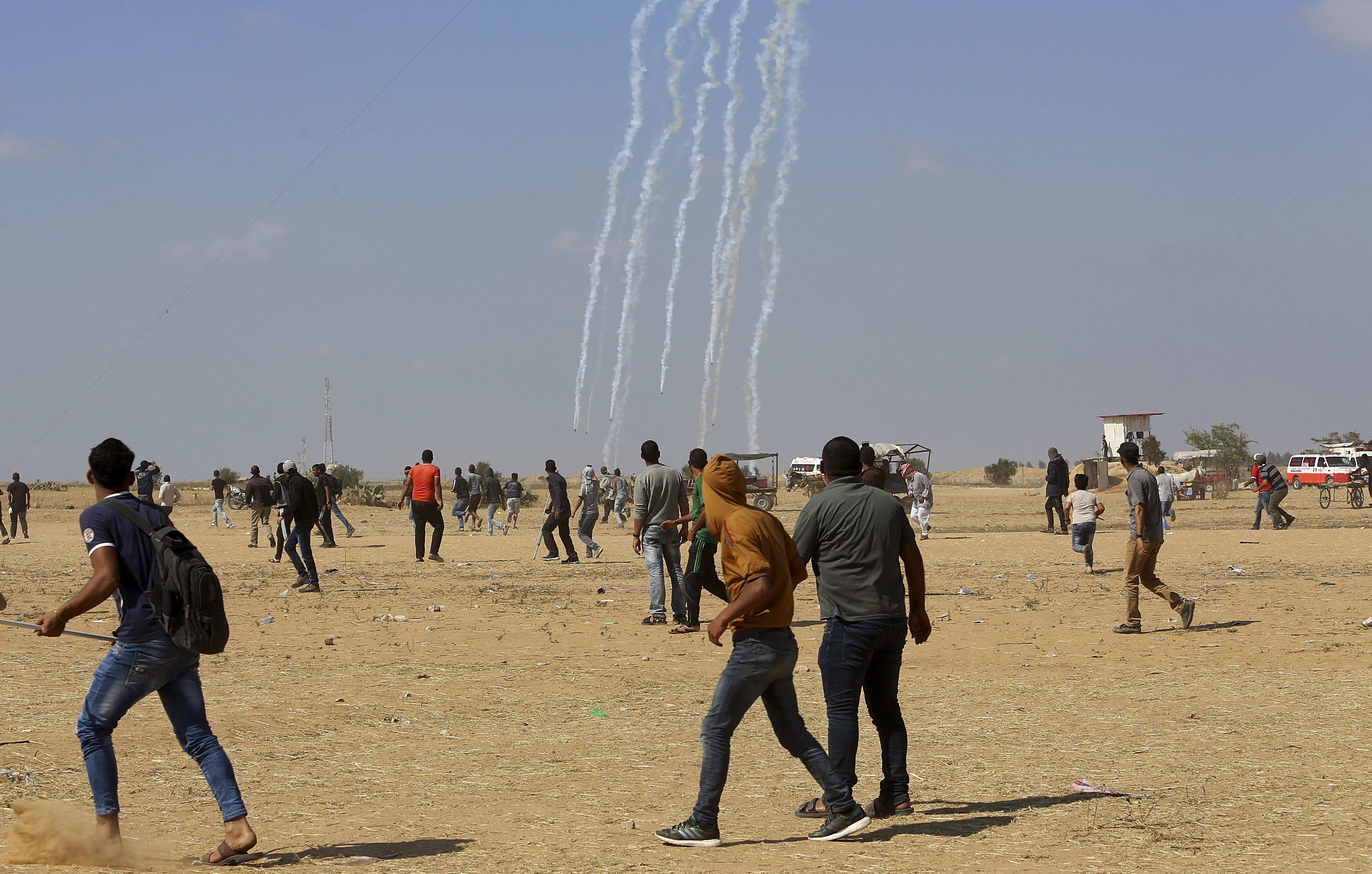 An Israeli drone fires teargas canisters on Palestinian protesters, east of Khan Younis, in the Gaza Strip, Tuesday, May 15, 2018. Israel faced a growing backlash Tuesday and new charges of using excessive force, a day after Israeli troops firing from across a border fence killed 59 Palestinians and wounded more than 2,700 at a mass protest in Gaza. (AP Photo/Adel Hana)