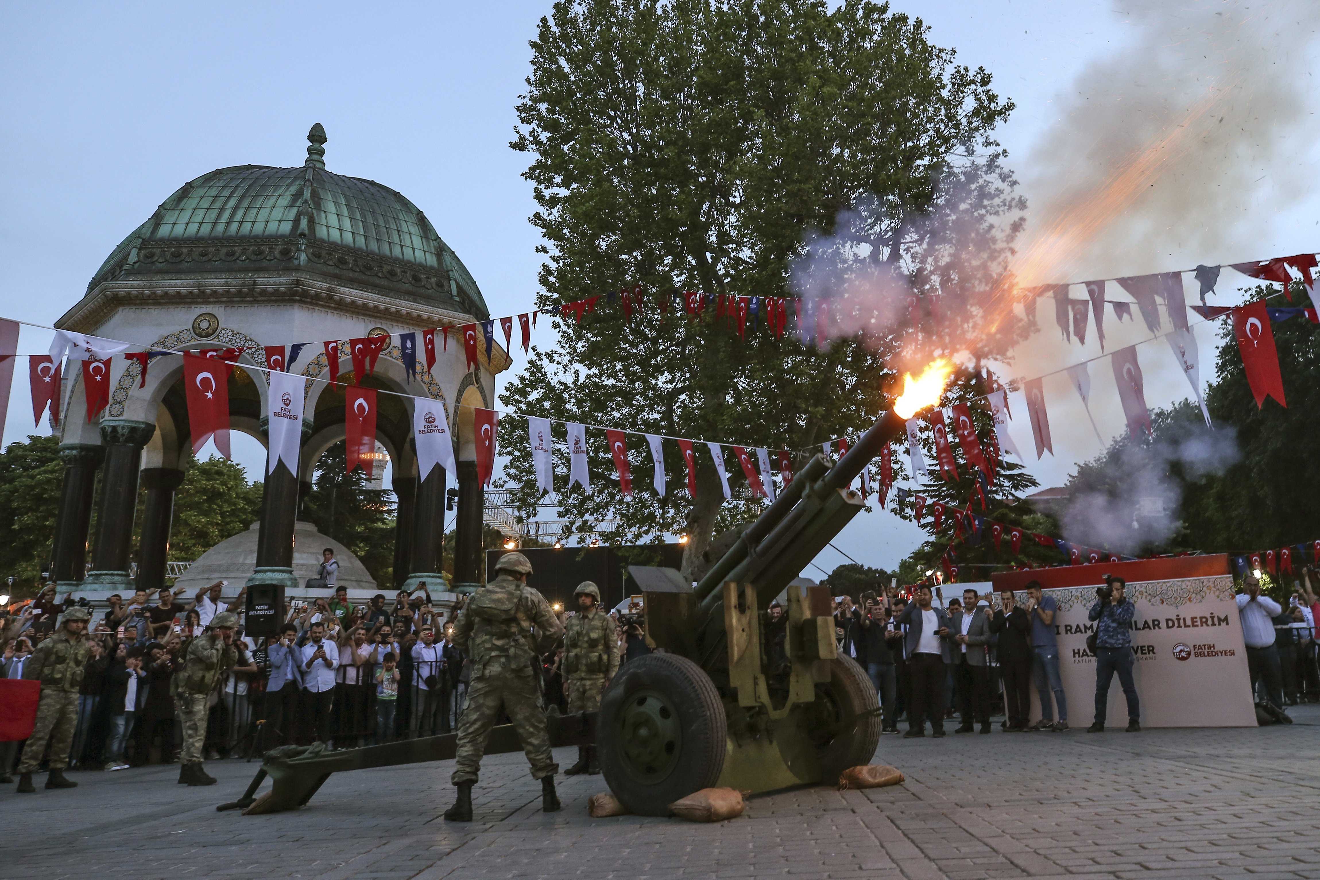A Turkish army artillery unit marks the end of fasting, in the historic Sultanahmet district of Istanbul, Wednesday, May 16, 2018 on the first day of the fasting month of Ramadan. Muslims throughout the world are marking Ramadan - a month of fasting during which the observants abstain from food, drink and other pleasures from sunrise to sunset. After an obligatory sunset prayer, a large feast known as 'iftar' is shared with family and friends. (AP Photo/Emrah Gurel)