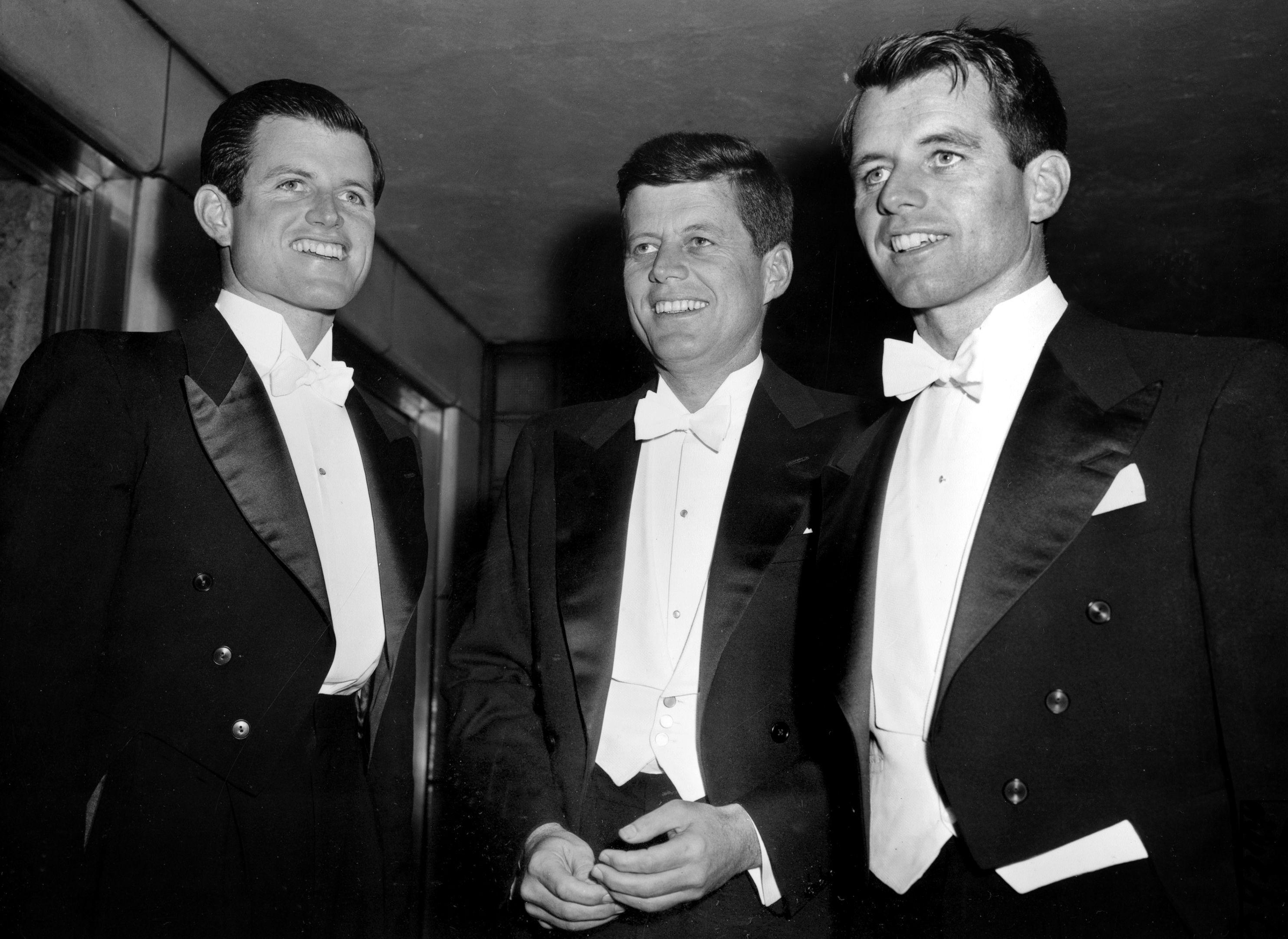 FILE-- Sen. John F. Kennedy, center, D-Mass., and his brothers Edward Kennedy, left, a student at the University of Virginia, and Robert F. Kennedy, chief counsel to the Senate Rackets Committee, attend the annual Gridiron Club dinner in Washington, D.C., on March 15, 1958. The suburban Boston house where Robert F. Kennedy was born, now a national historic site in tribute to his more famous brother, President John F. Kennedy, is holding a special exhibition to mark the 50th anniversary of RFK's assassination on June 6, 1968. (AP Photo)